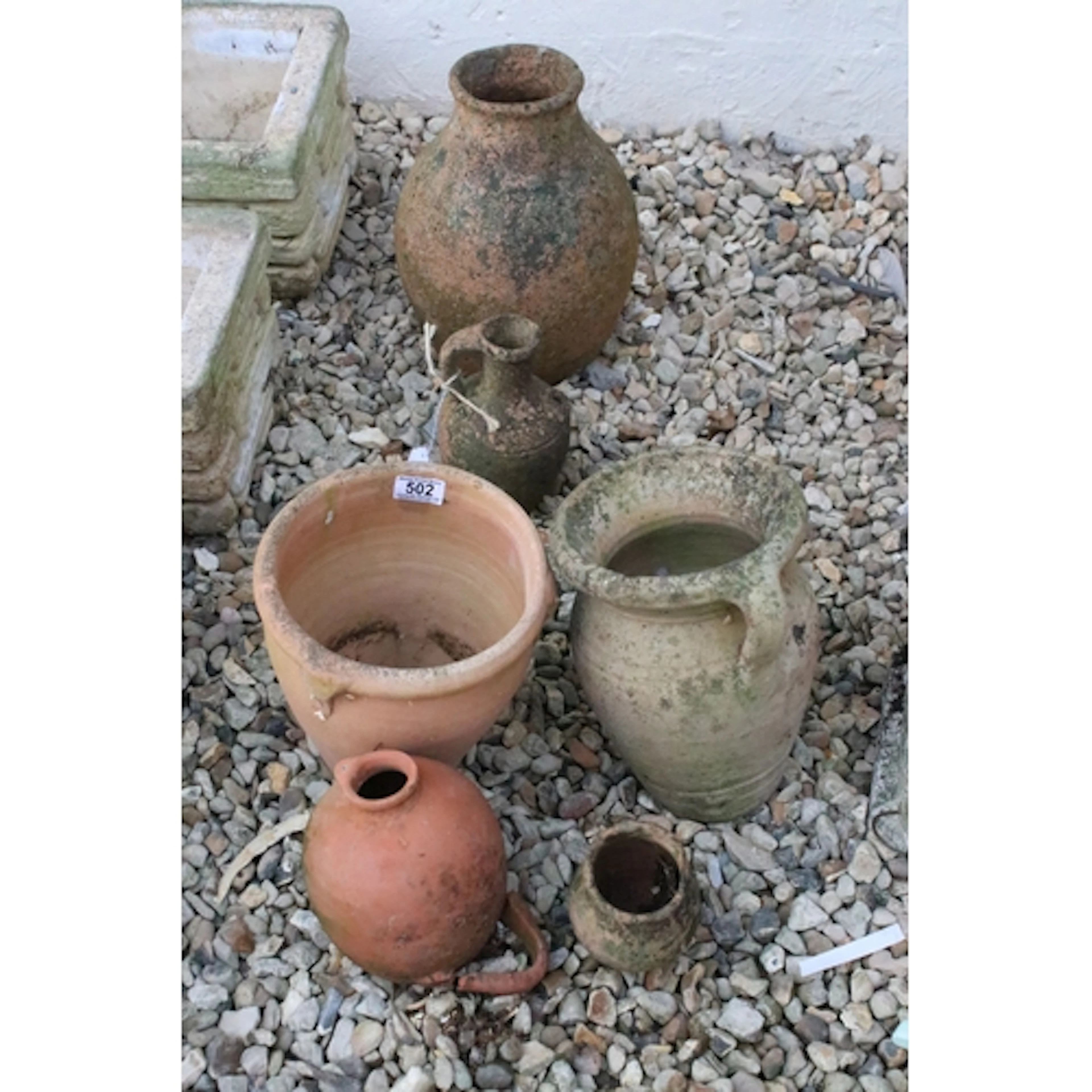 Six garden pots to include terracotta examples, tallest meas...
