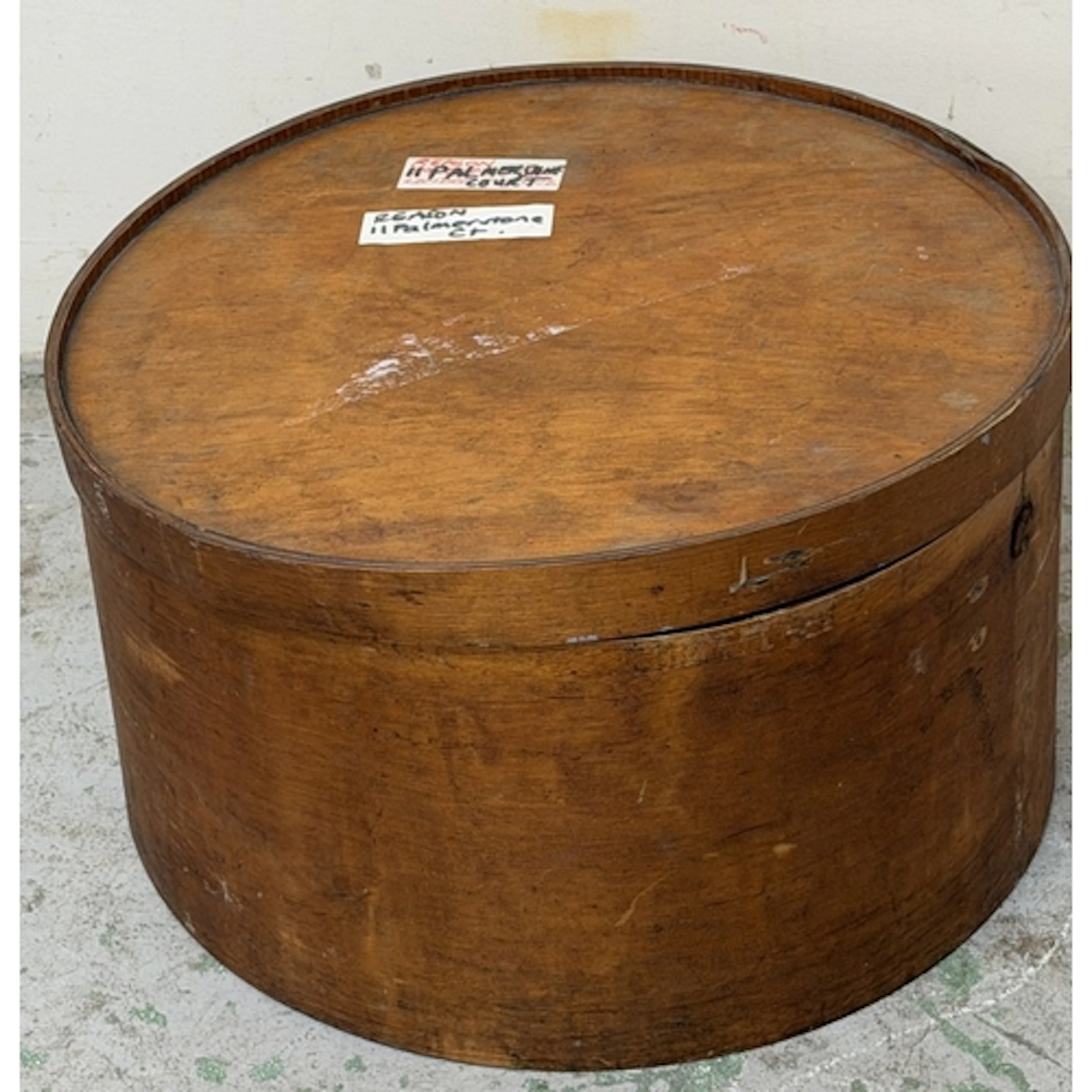 A wooden hat storage box