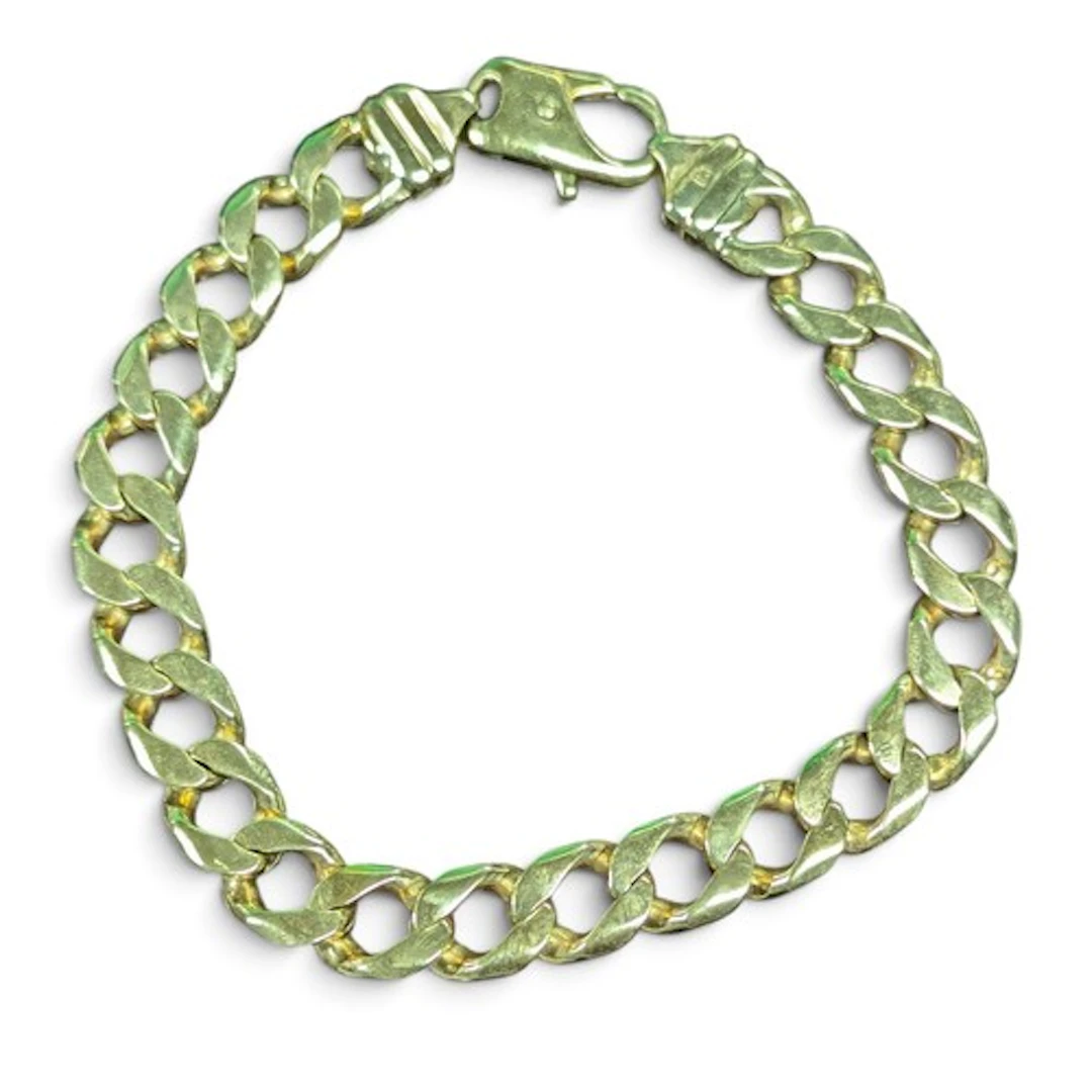 A yellow metal curb link bracelet, 26cm long, marked 375 GM,...