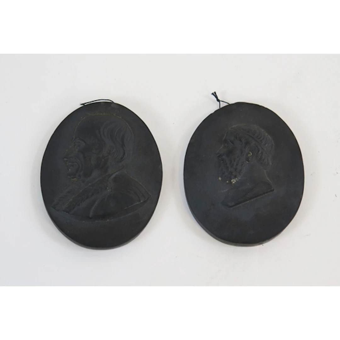 Two Wedgwood basalt ware cameos each 6cm long. (2)