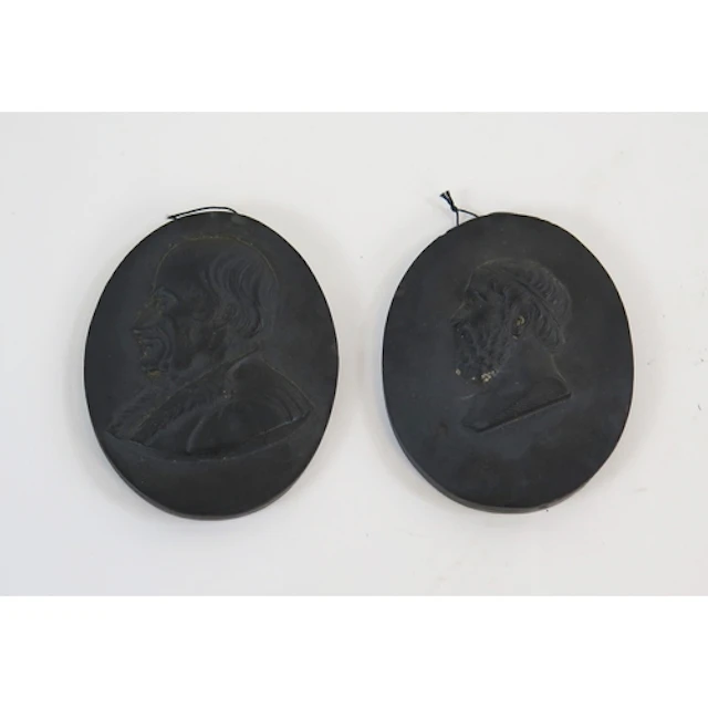 Two Wedgwood basalt ware cameos each 6cm long. (2)