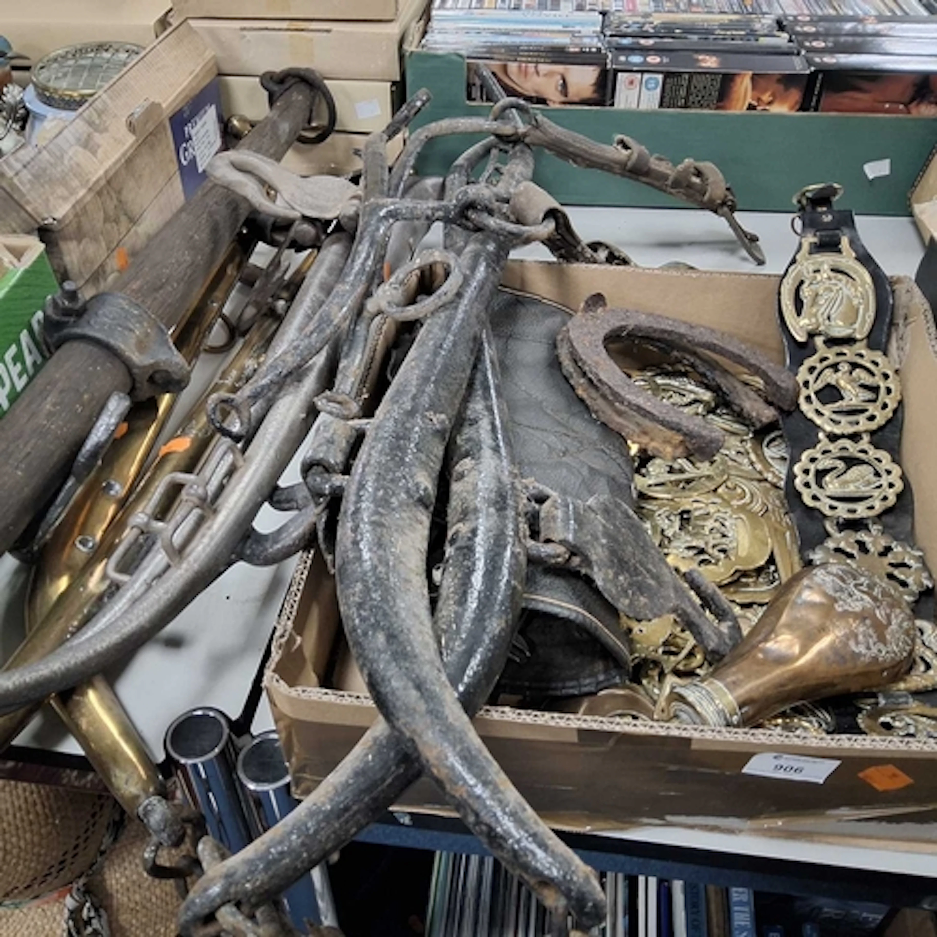 A GROUP OF HORSE TACK AND BRASSES comprising a box of assort...