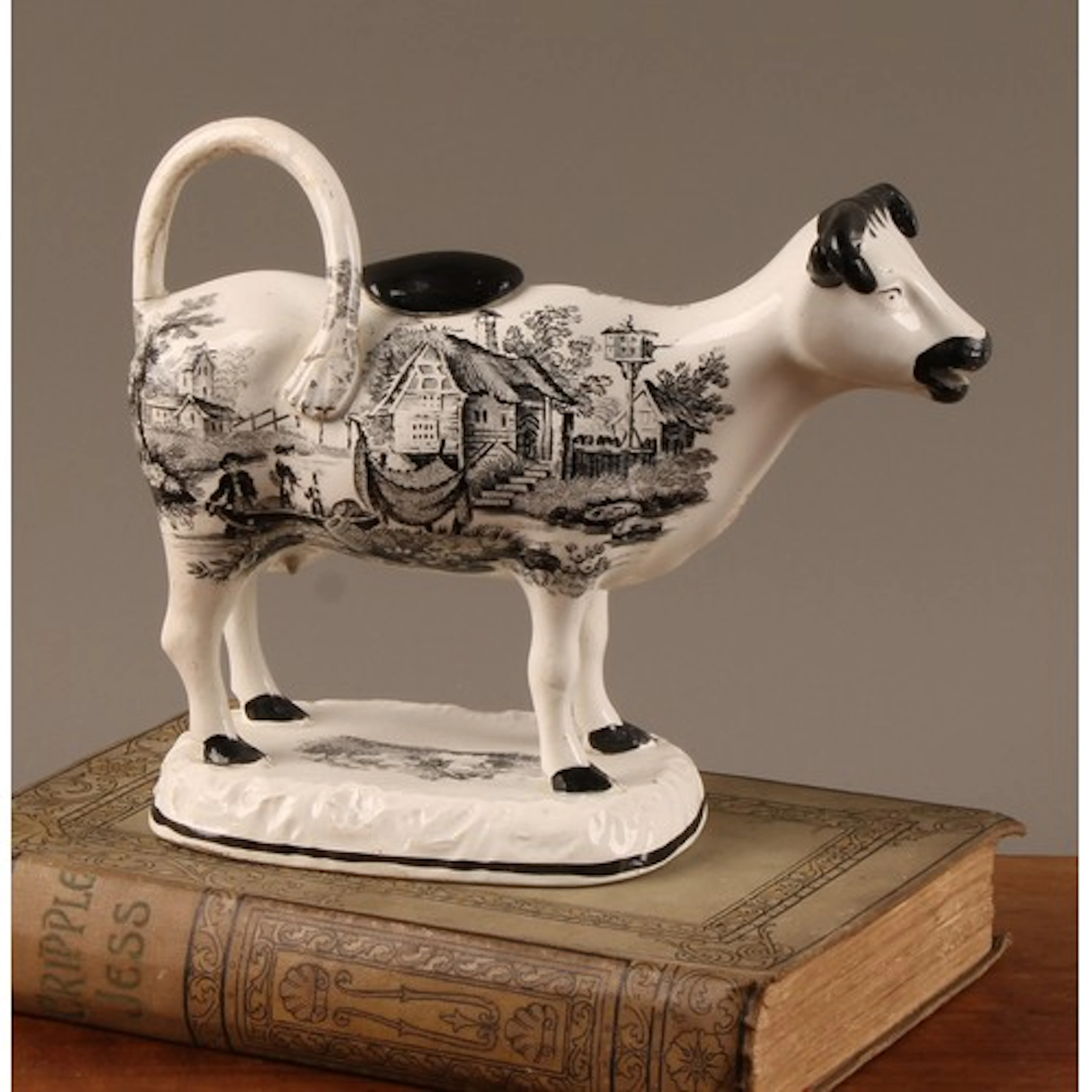 A 19th century Glamorgan Pottery cow creamer, in full aspect...