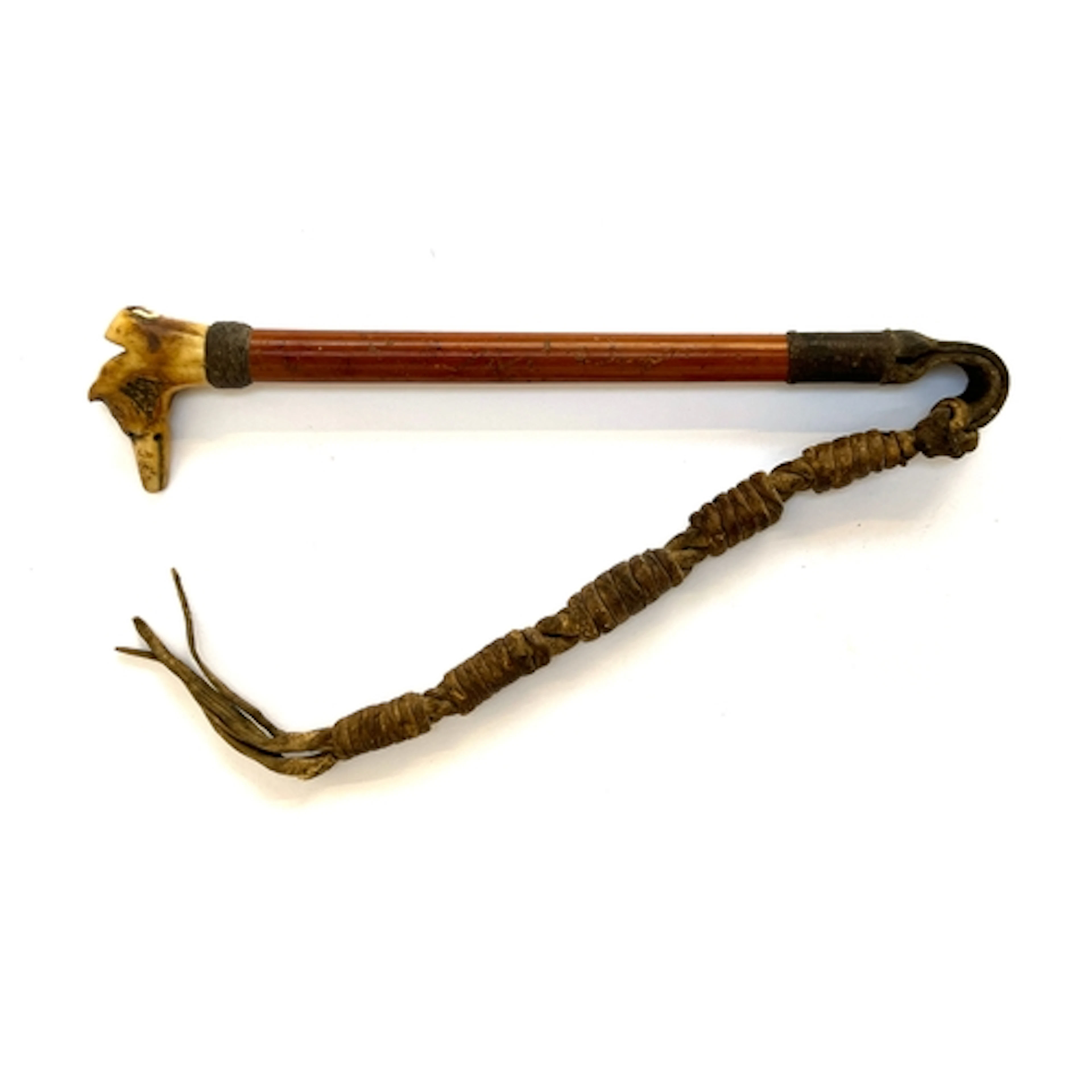 A small Victorian malacca riding whip with a carved antler w...