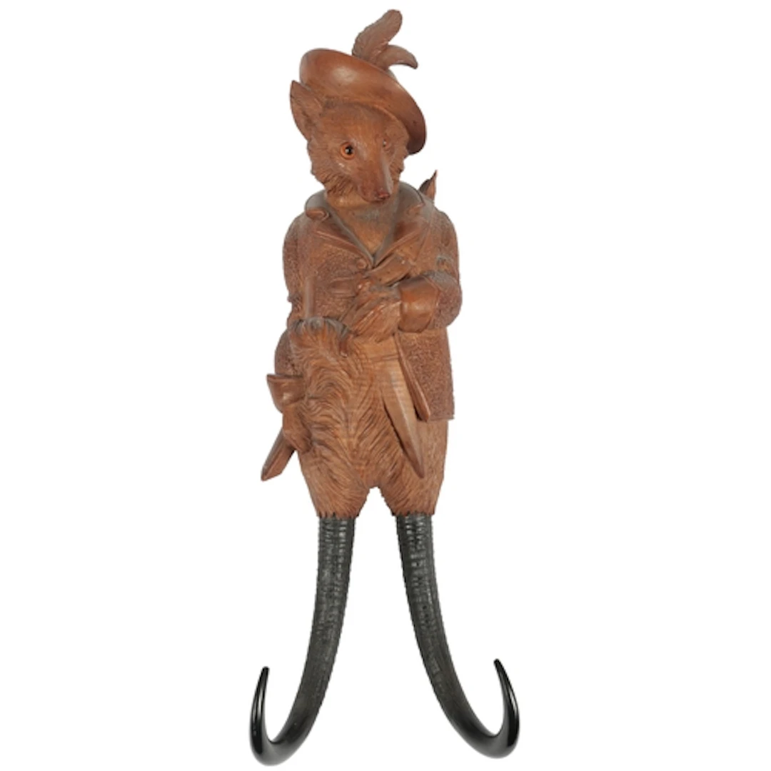 A Black Forest fox carved musical coat hook, late 19th centu...