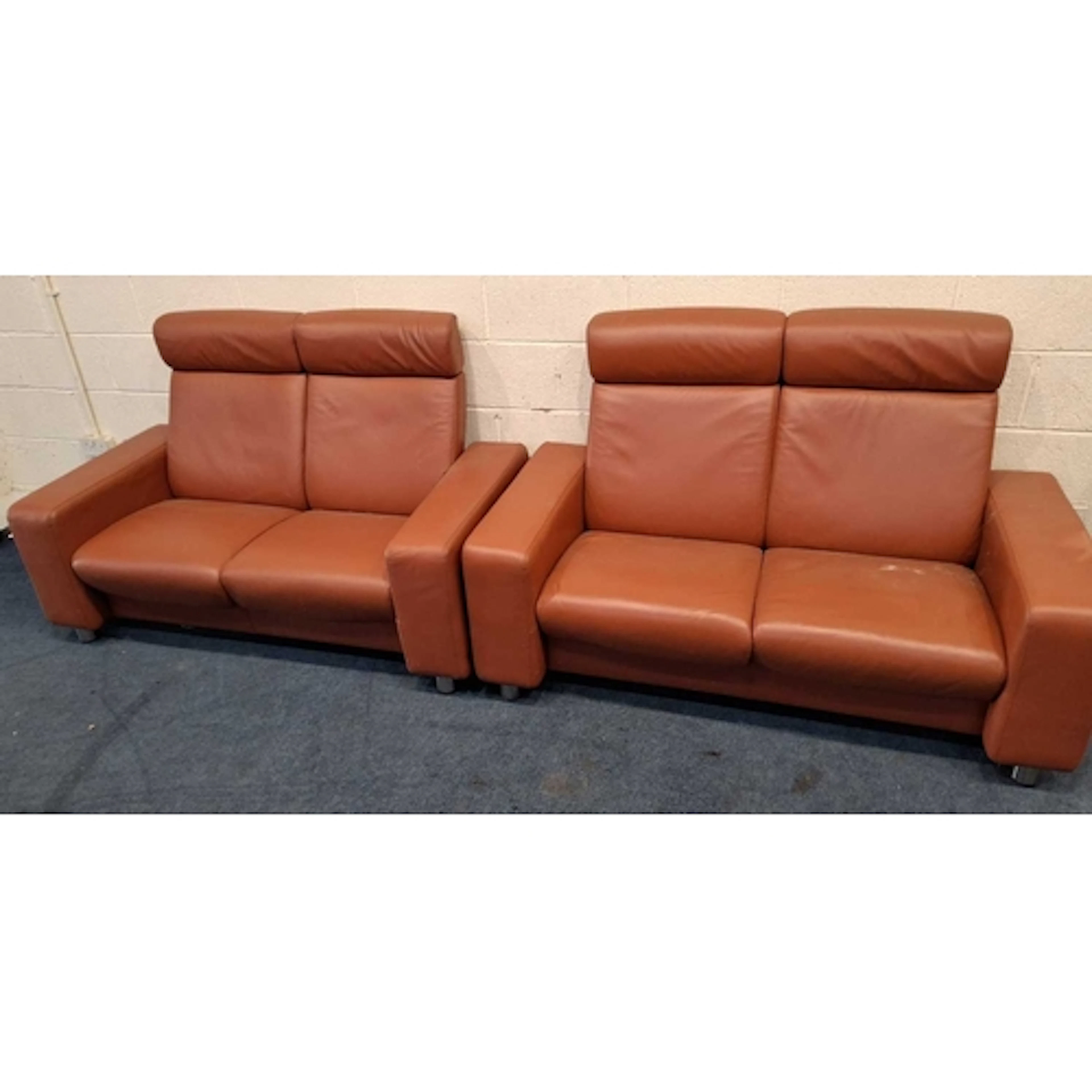 A PAIR OF EKORNES STRESSLESS RECLINING TWO SEATER SOFAS (wi...