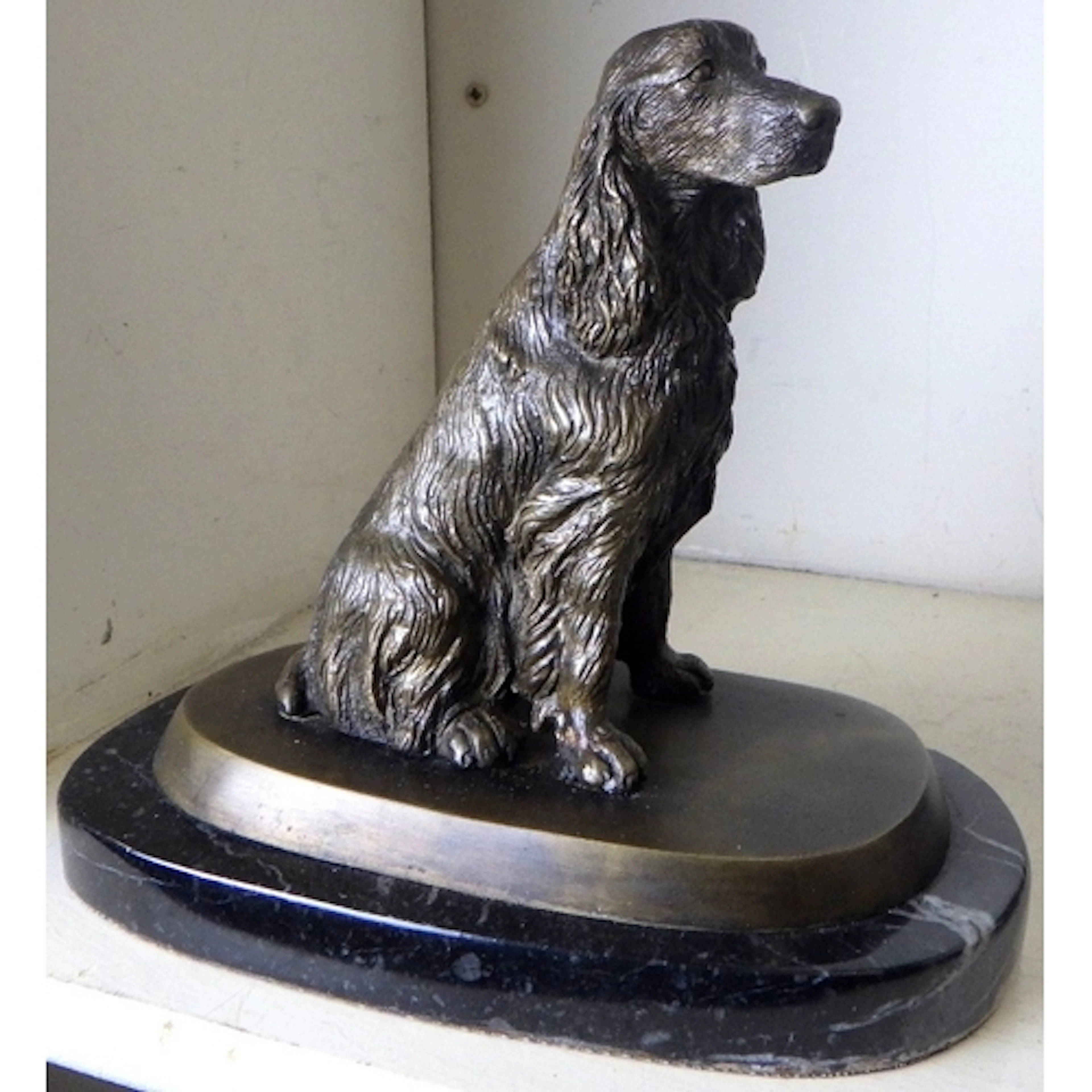 A cast bronze? Spaniel on a marble base 16cm tall