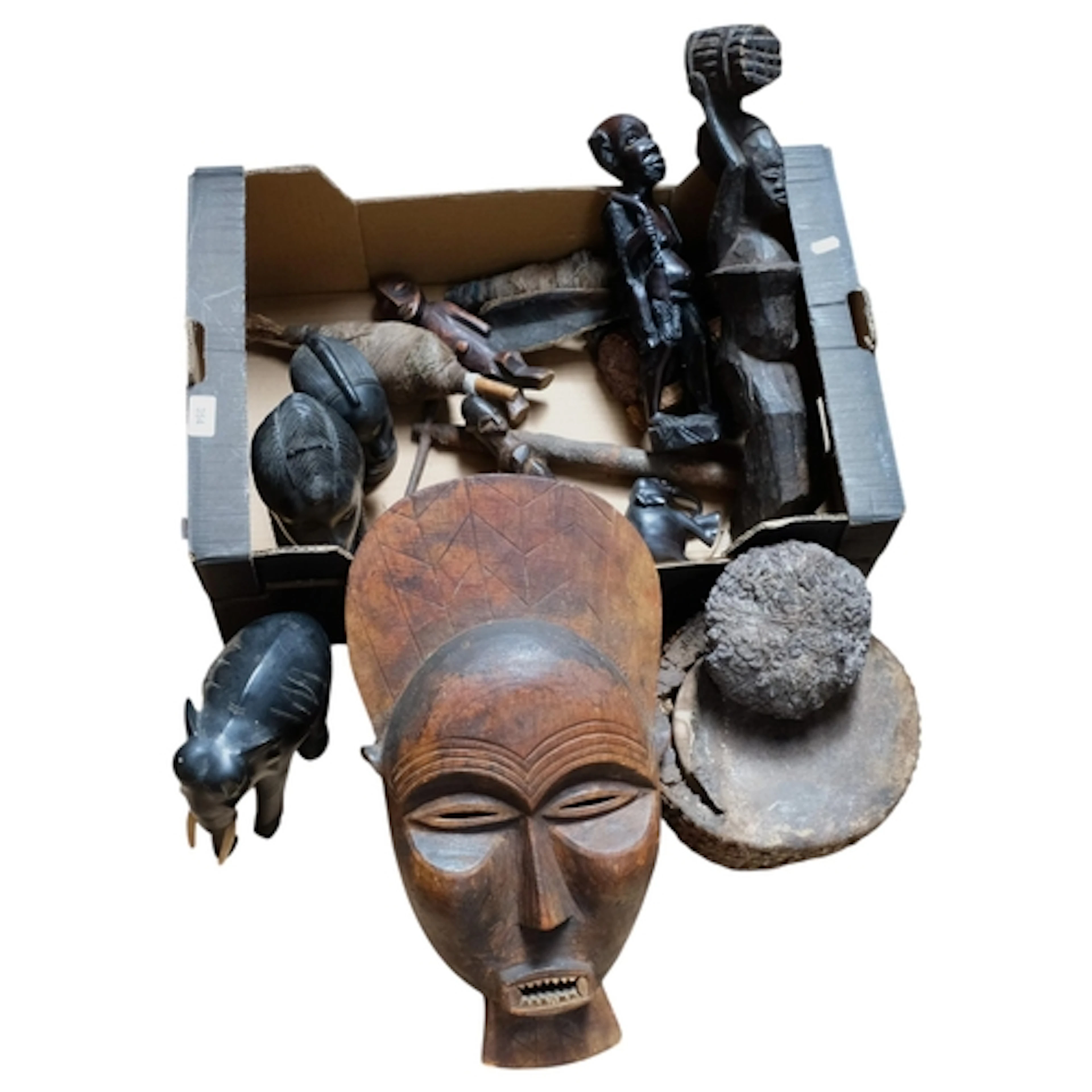 A quantity of various African Tribal carvings, wall mask, eb...