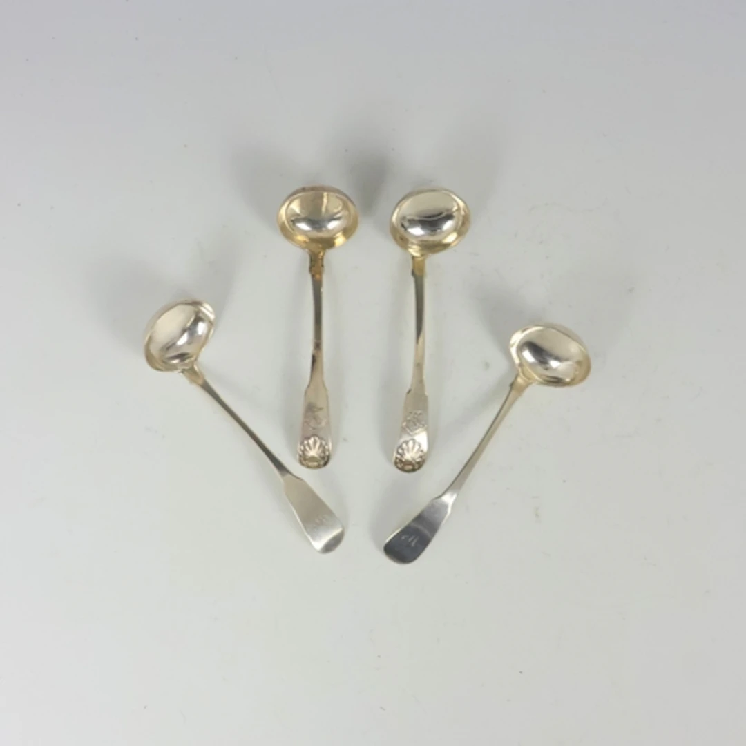 A pair of George IV silver Fiddle Pattern silver sauce ladle...
