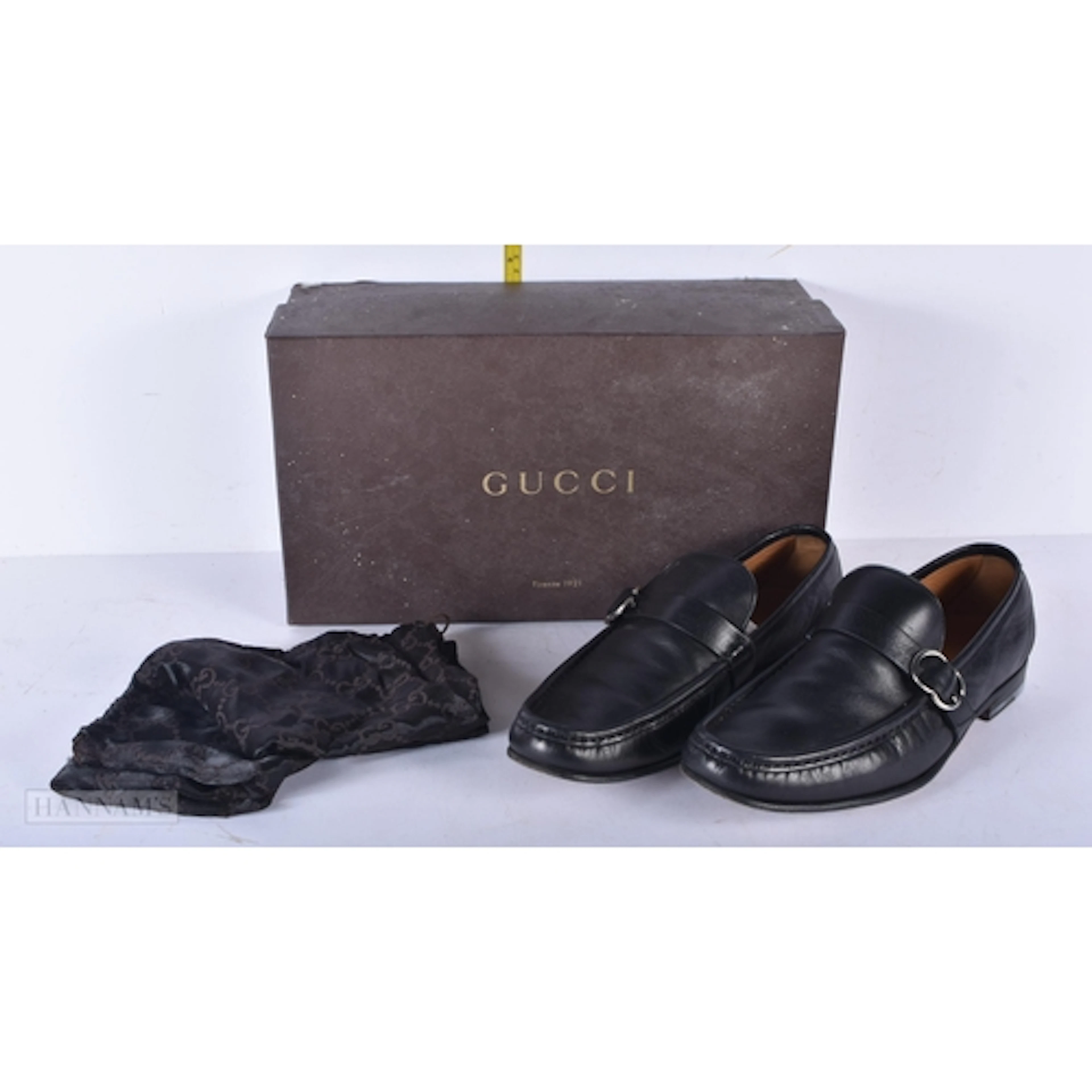 A pair of Gucci men's shoes with original box size 8.5 .