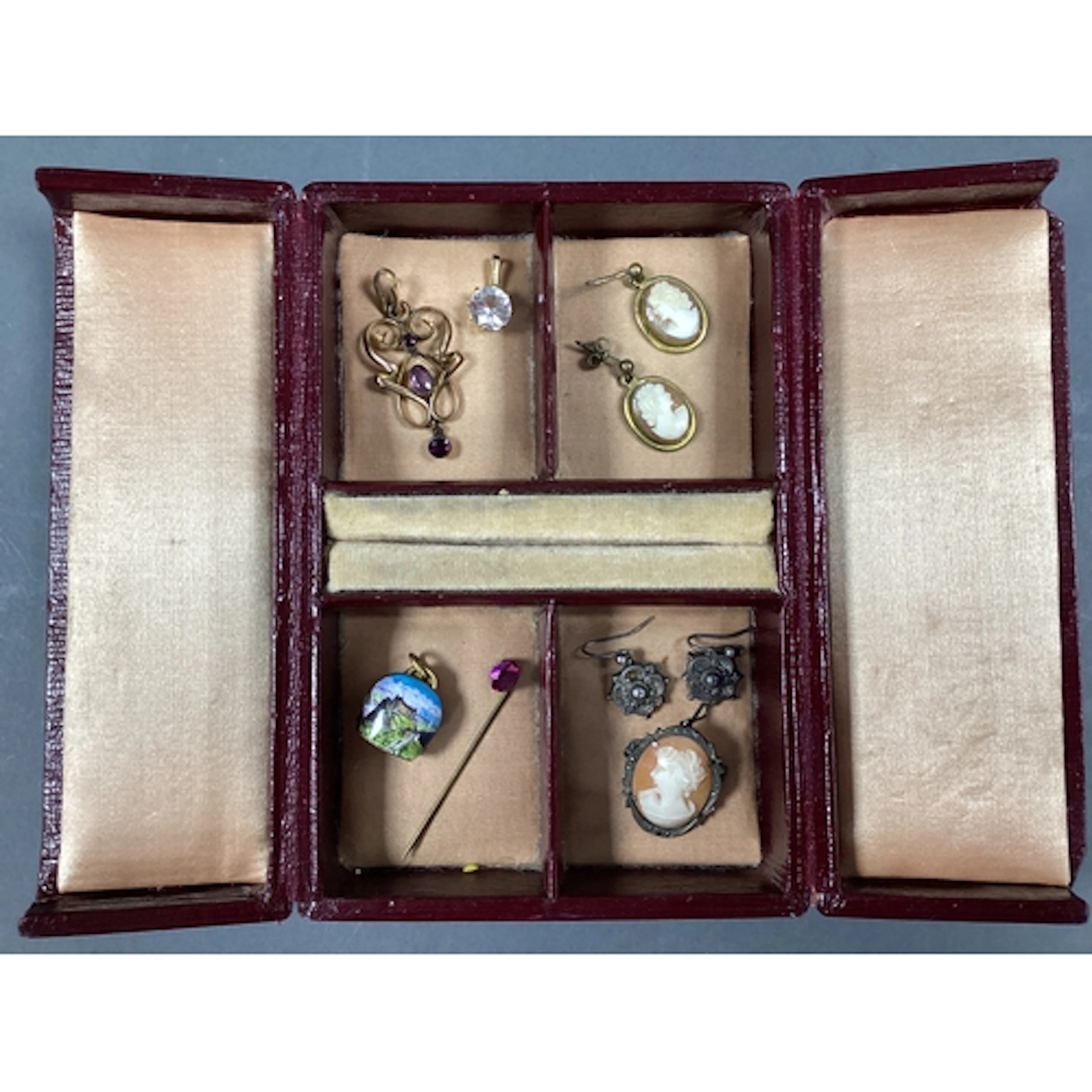 An Edwardian Style Openwork Drop Pendant, the collet set hig...