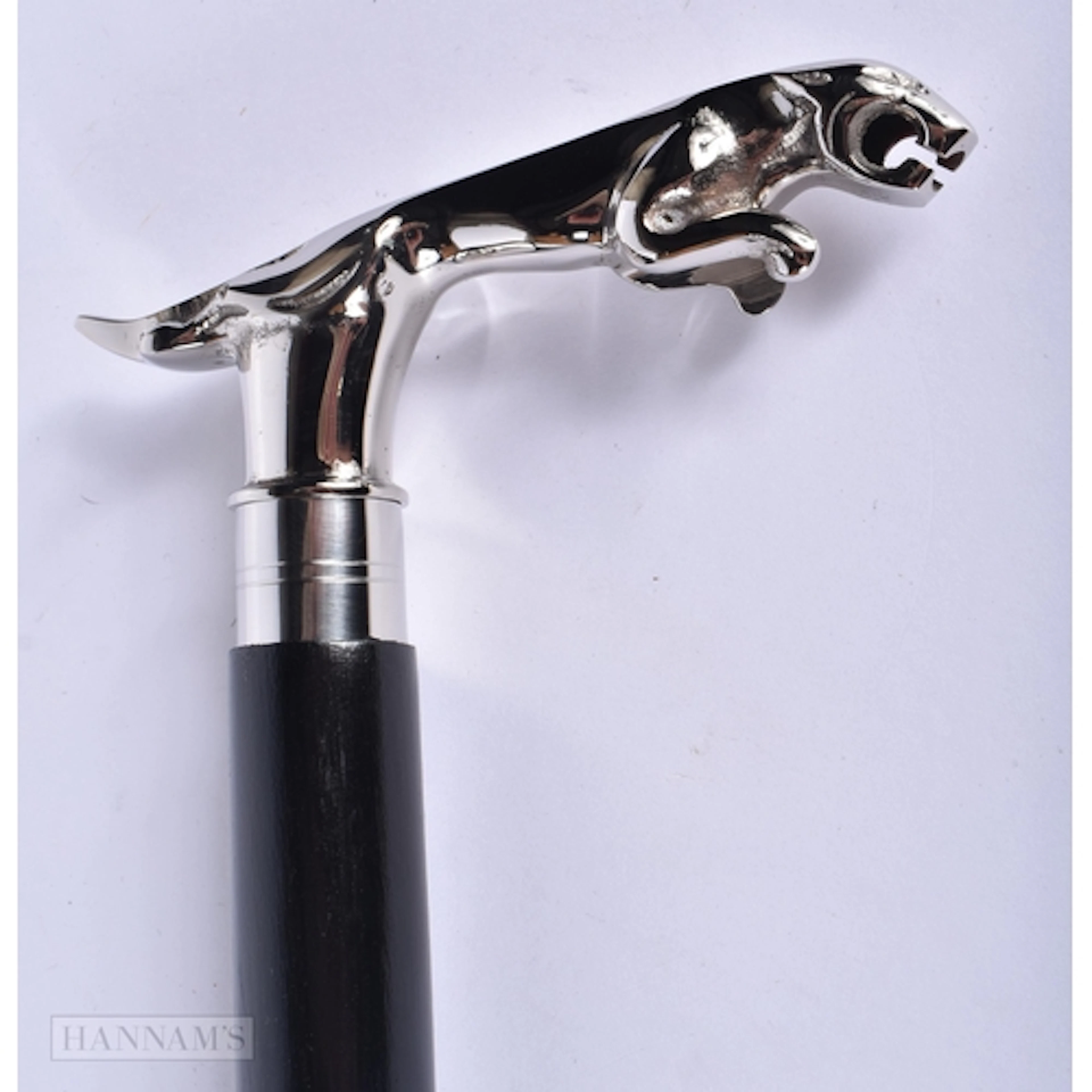 A wooden walking cane with a nickel plated 'jaguar mascot' h...