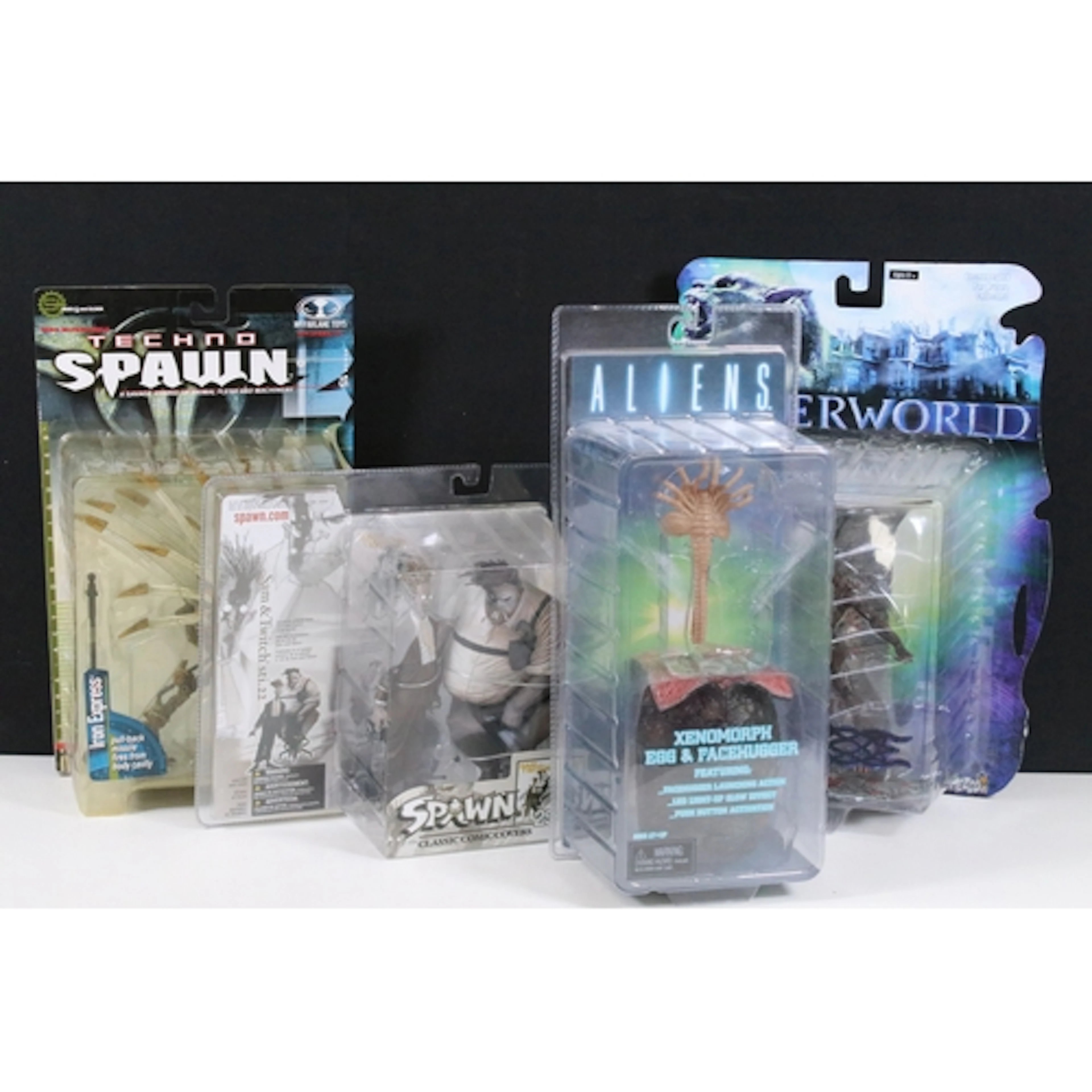 Four boxed / carded action figures to include Spawn Classic ...