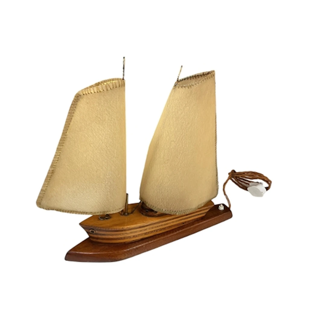 An Art Deco style mahogany and pine lamp modelled as a yacht...