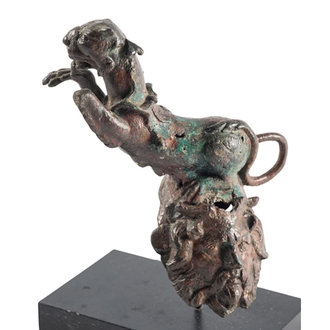 A ROMAN BRONZE PANTHER PROTOME WITH SATYR MASK CIRCA 2ND-3RD...