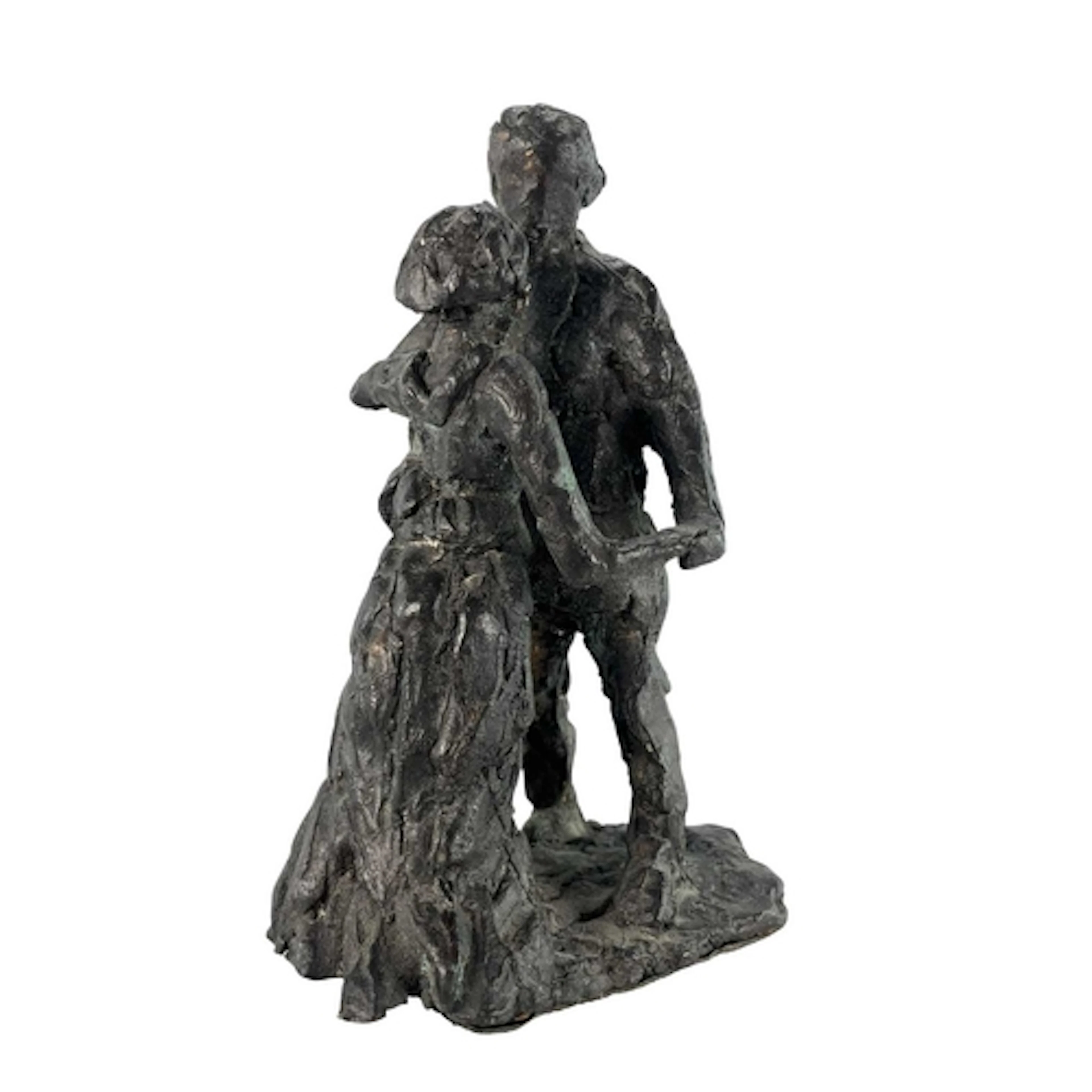 A mid 20th century circa 1943 bronze sculpture of a couple. ...