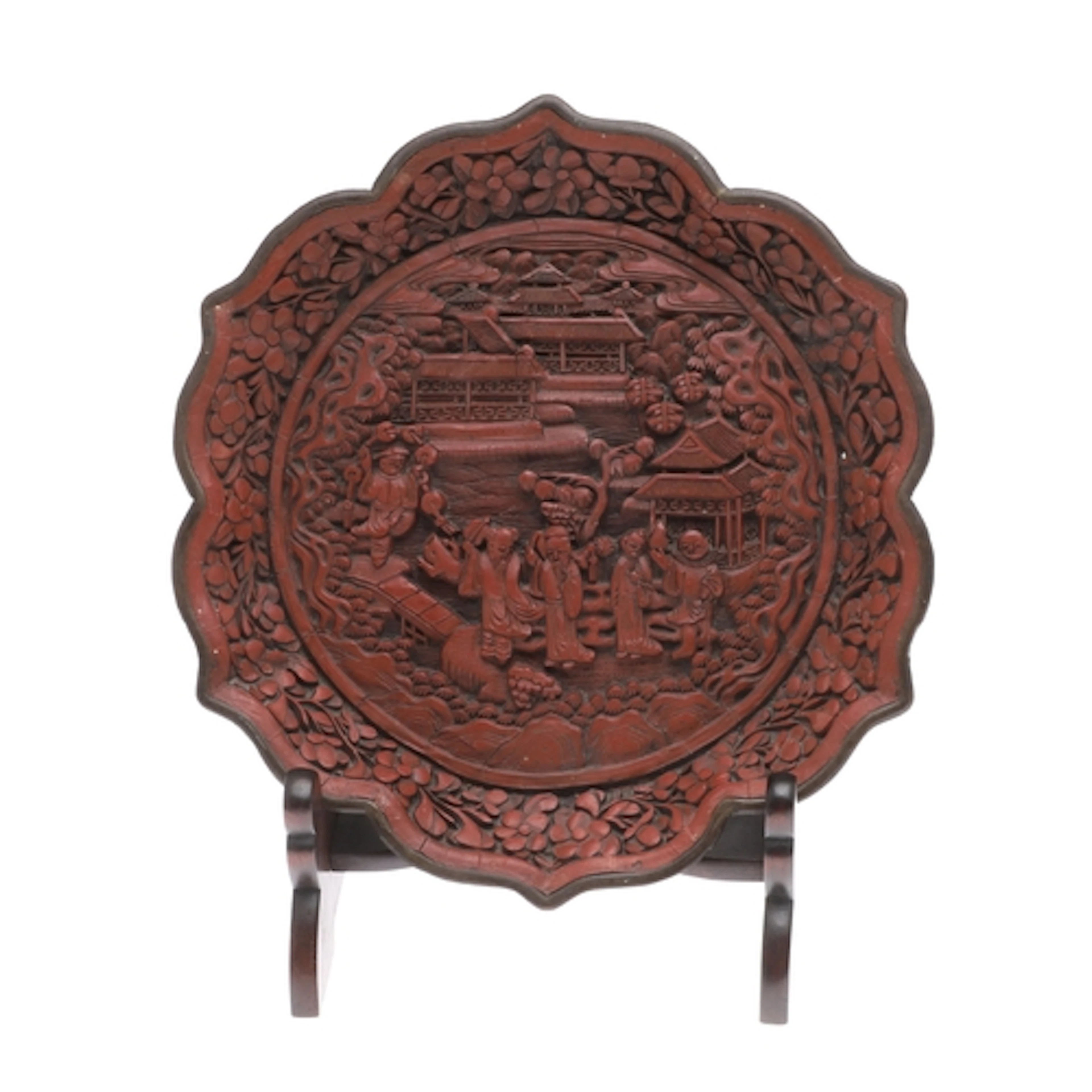 CHINESE CINNEBAR LACQUER PLATE. A wall plate of lobed shape,...