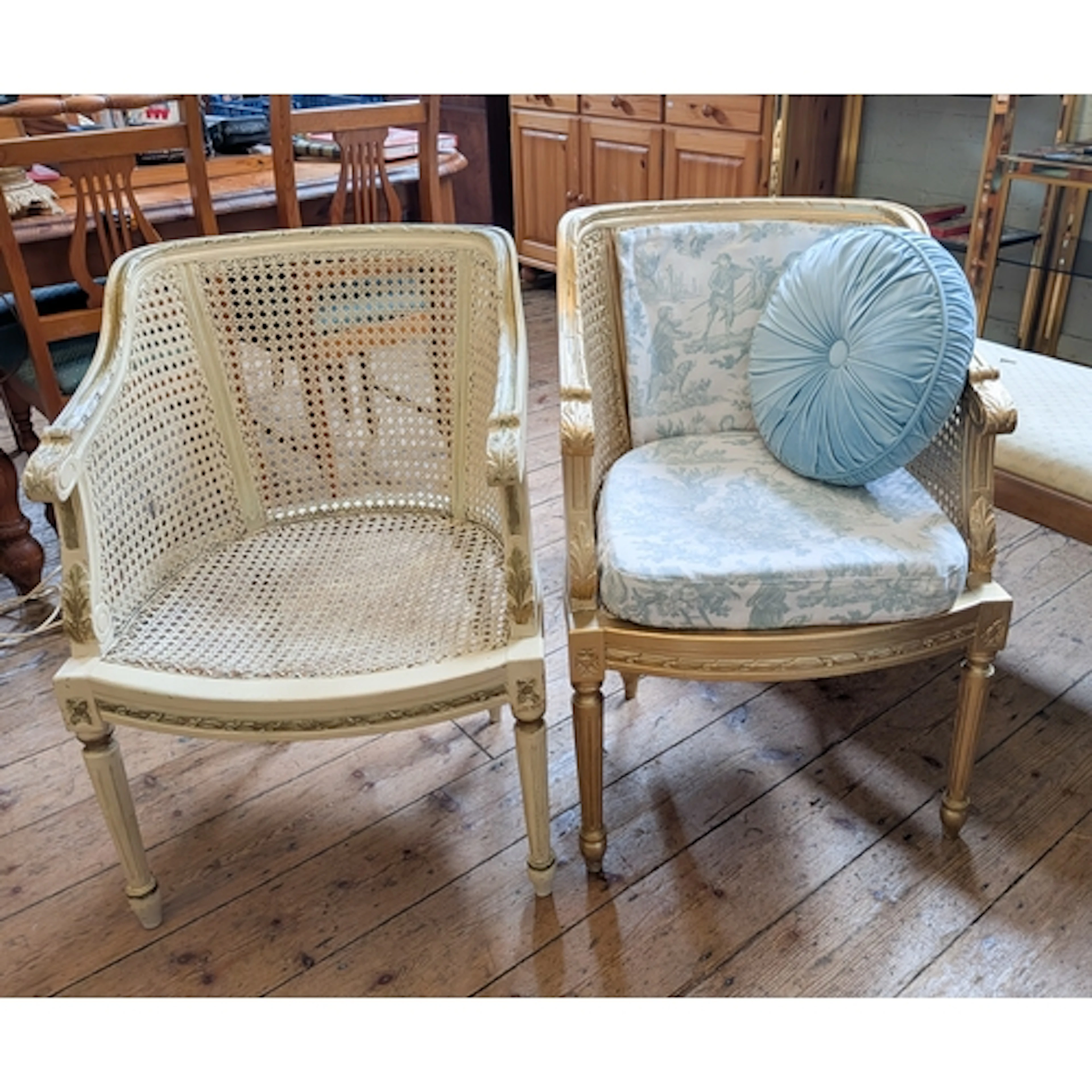 Two French style wicker work elbow chairs, one upholstered w...