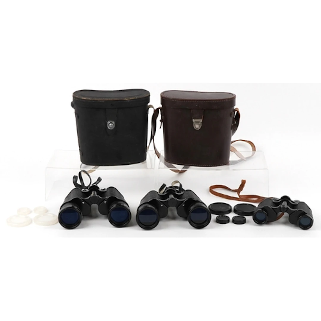 Three pairs of vintage binoculars comprising Prinz 8 x 30, P...