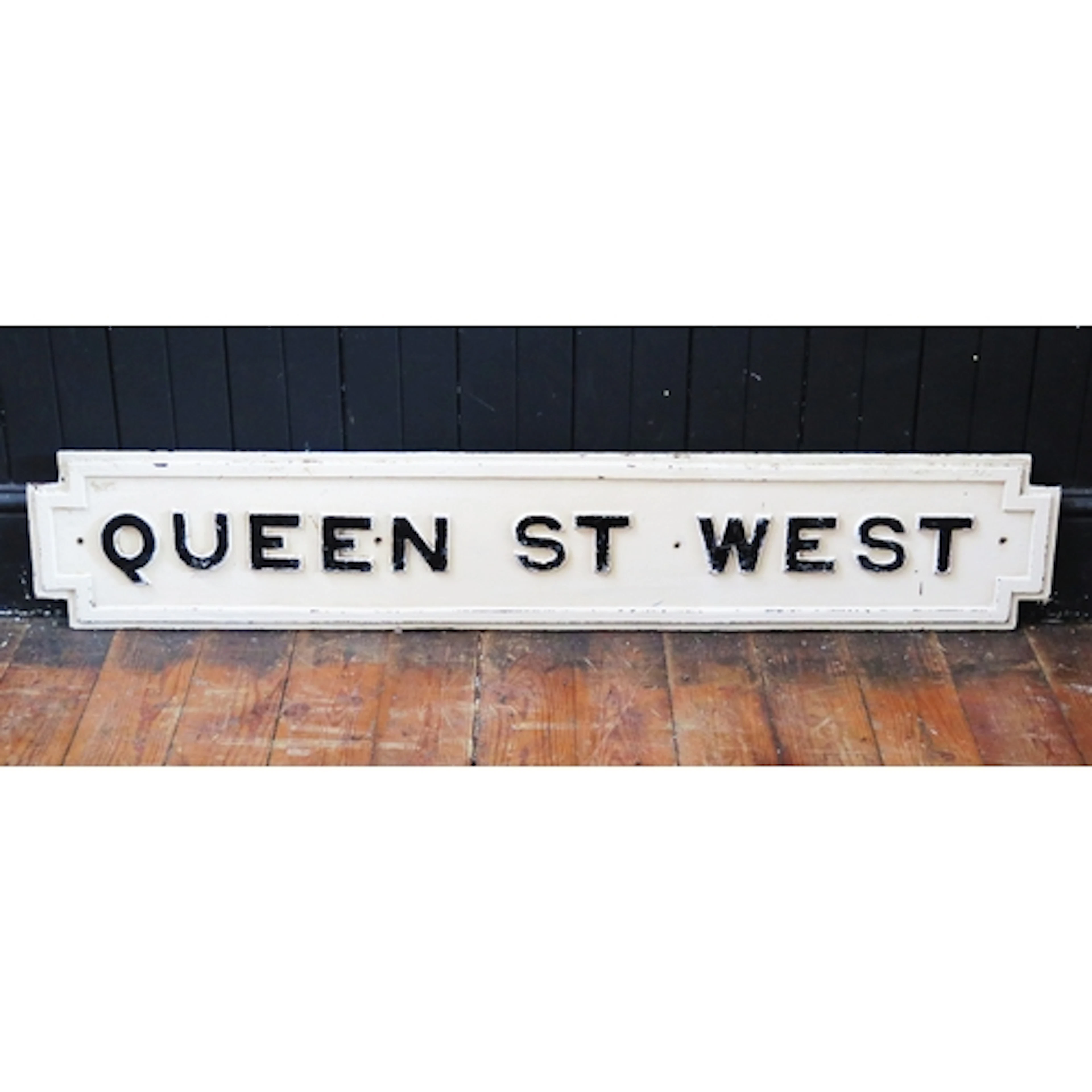 "Queen St West" - a black and white painted cast iron street...