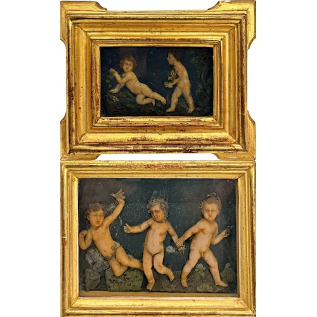 A fine pair of decorative polychrome wax reliefs depicting l...
