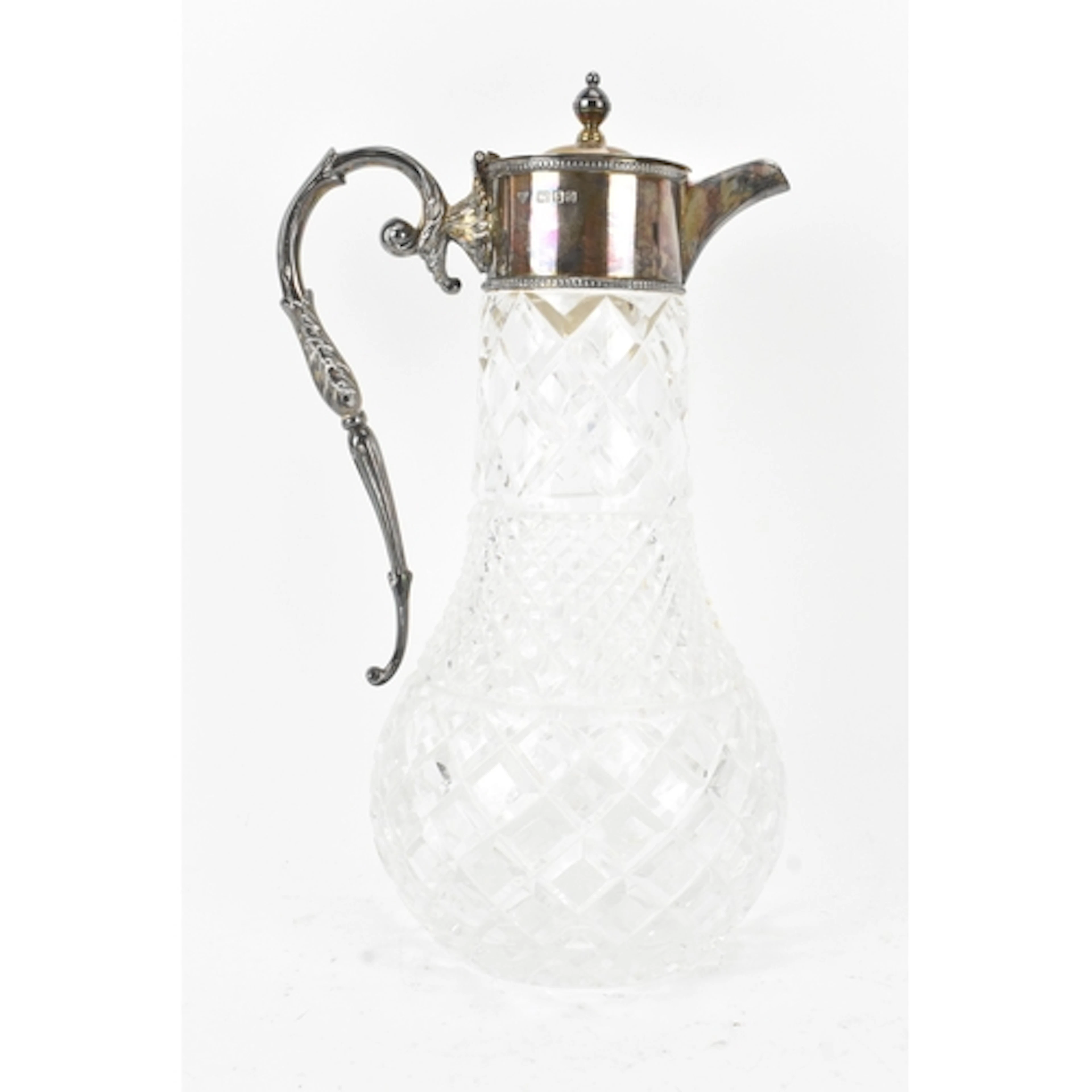 An Elizabeth II silver and cut glass claret jug, by Garrard ...