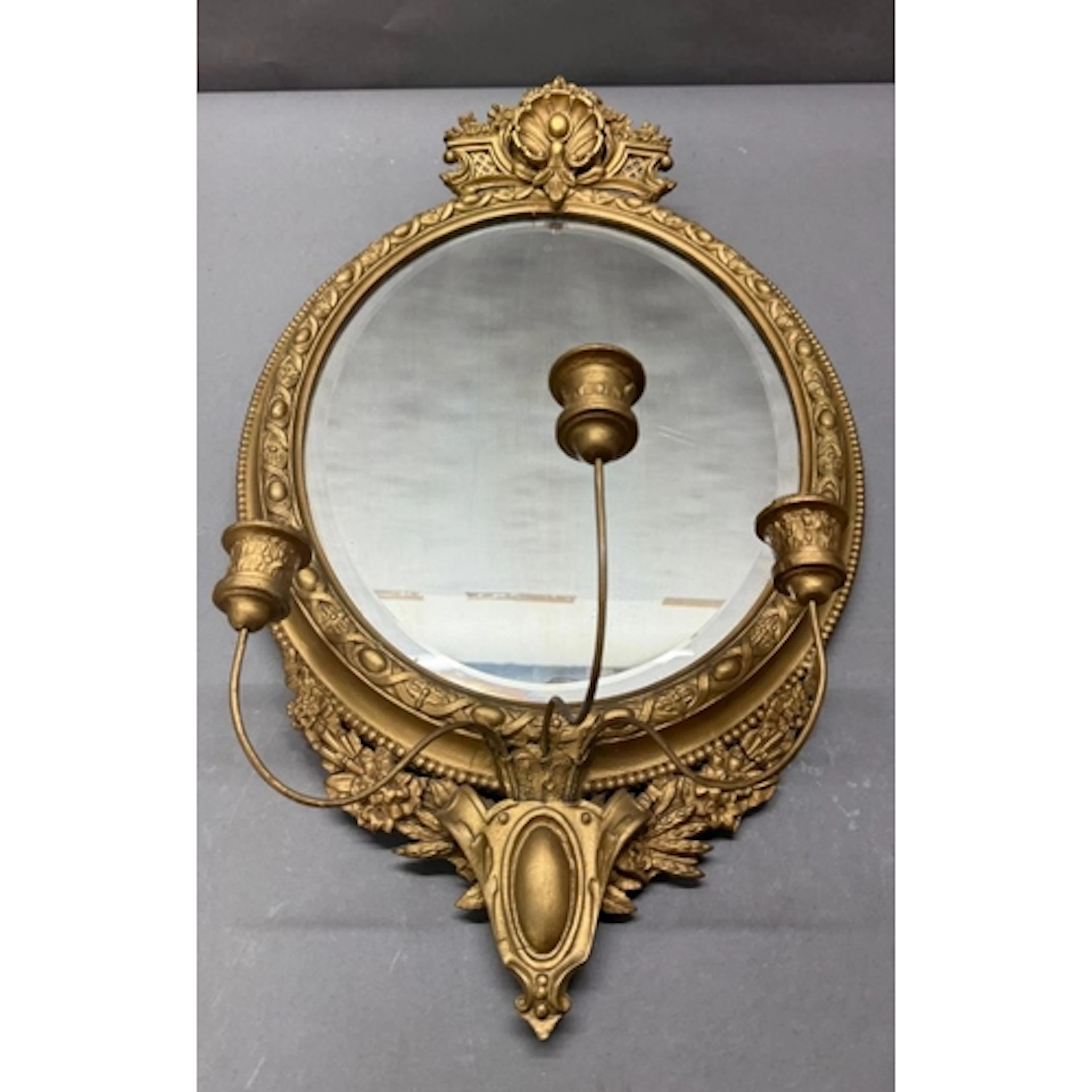 A Girandole wall mirror with three arm candelabra and gilt f...