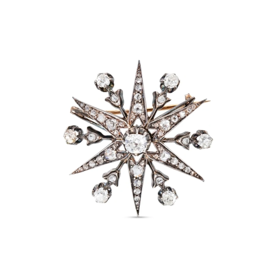 A VICTORIAN DIAMOND STAR BURST BROOCH, mounted in gold and s...