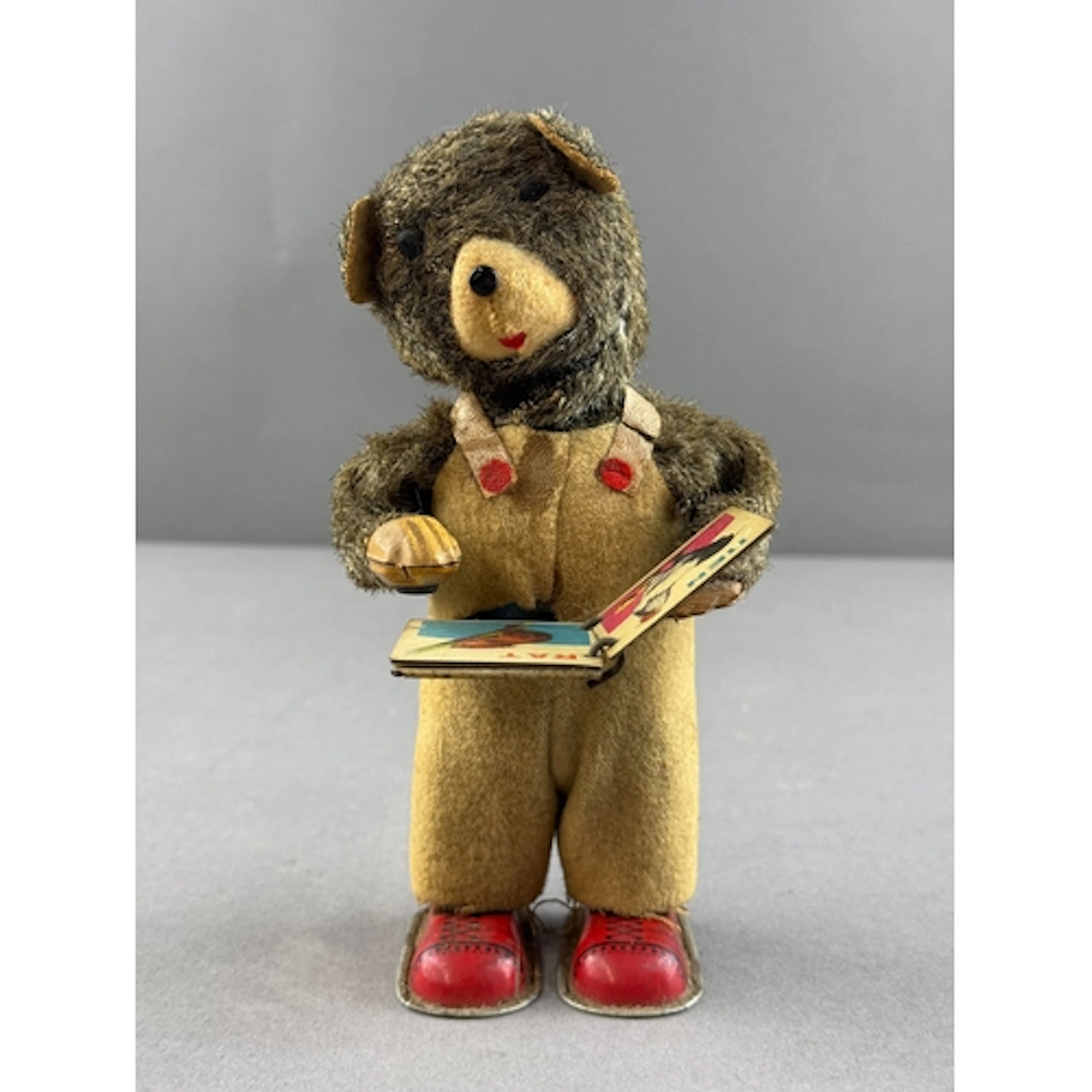 Toys: a mid century Japanese tinplate anthropomorphic bear d...