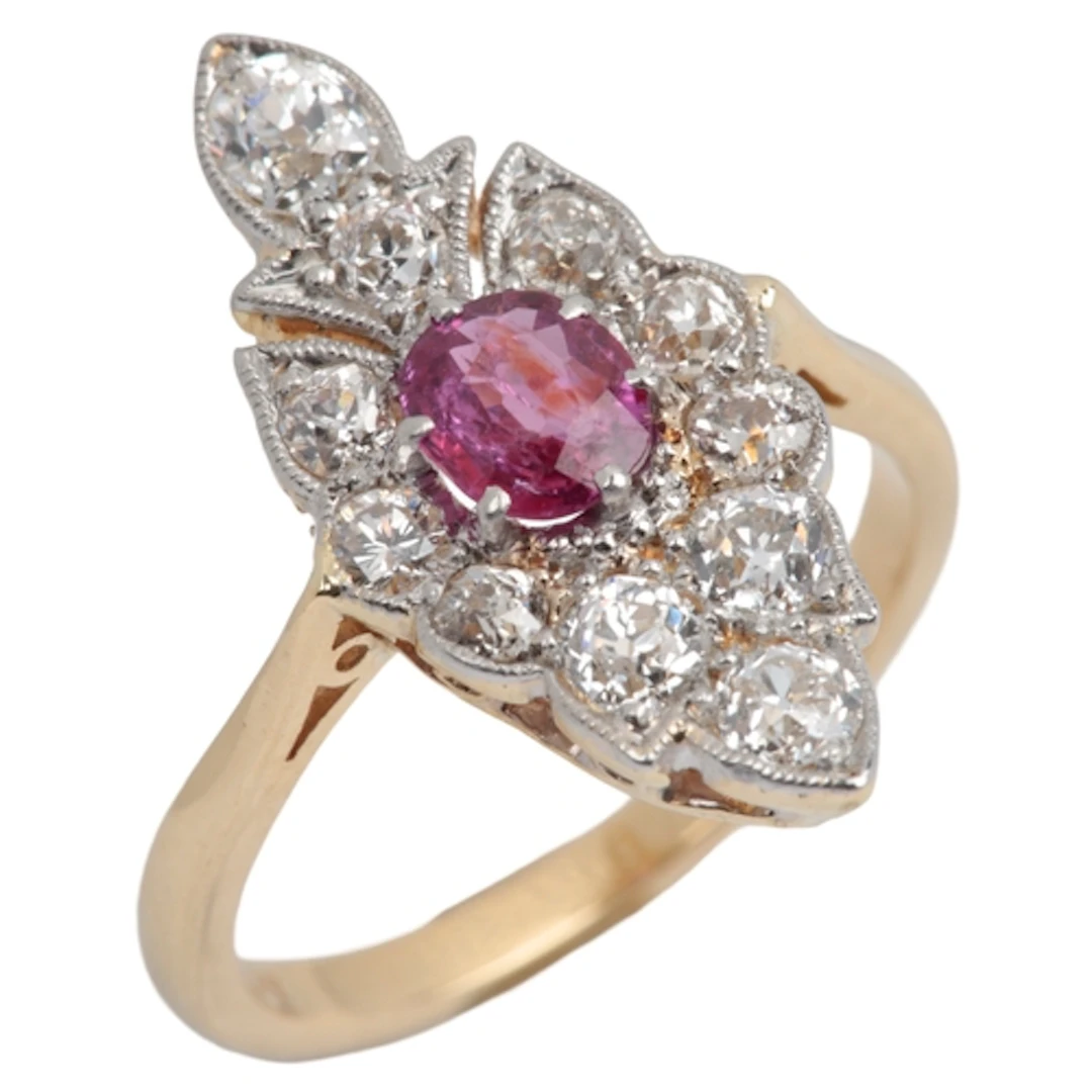 A pink sapphire and diamond ring, centring on an oval pink s...