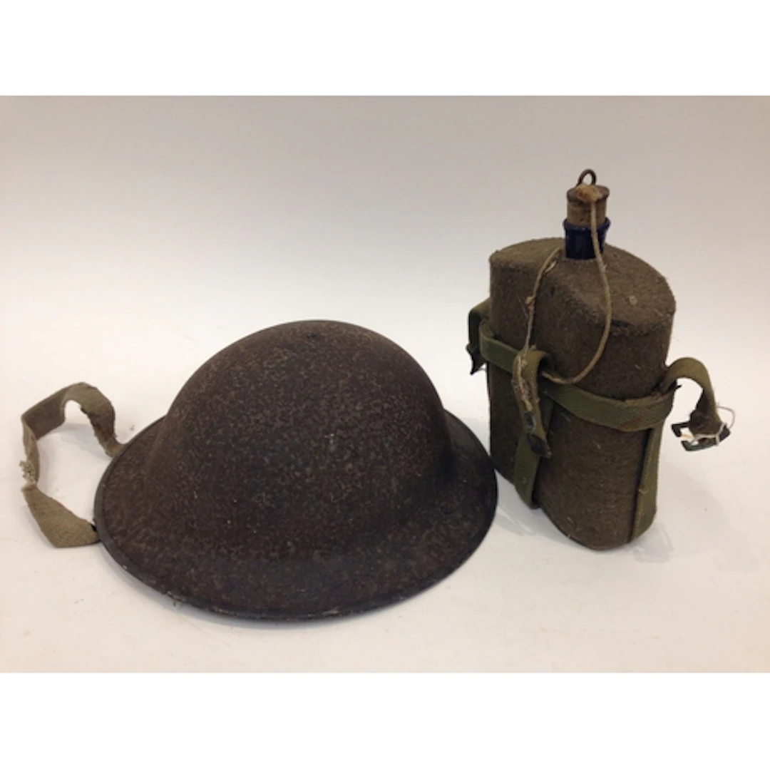 A British WWI Brodie Helmet. Of steel construction with canv...