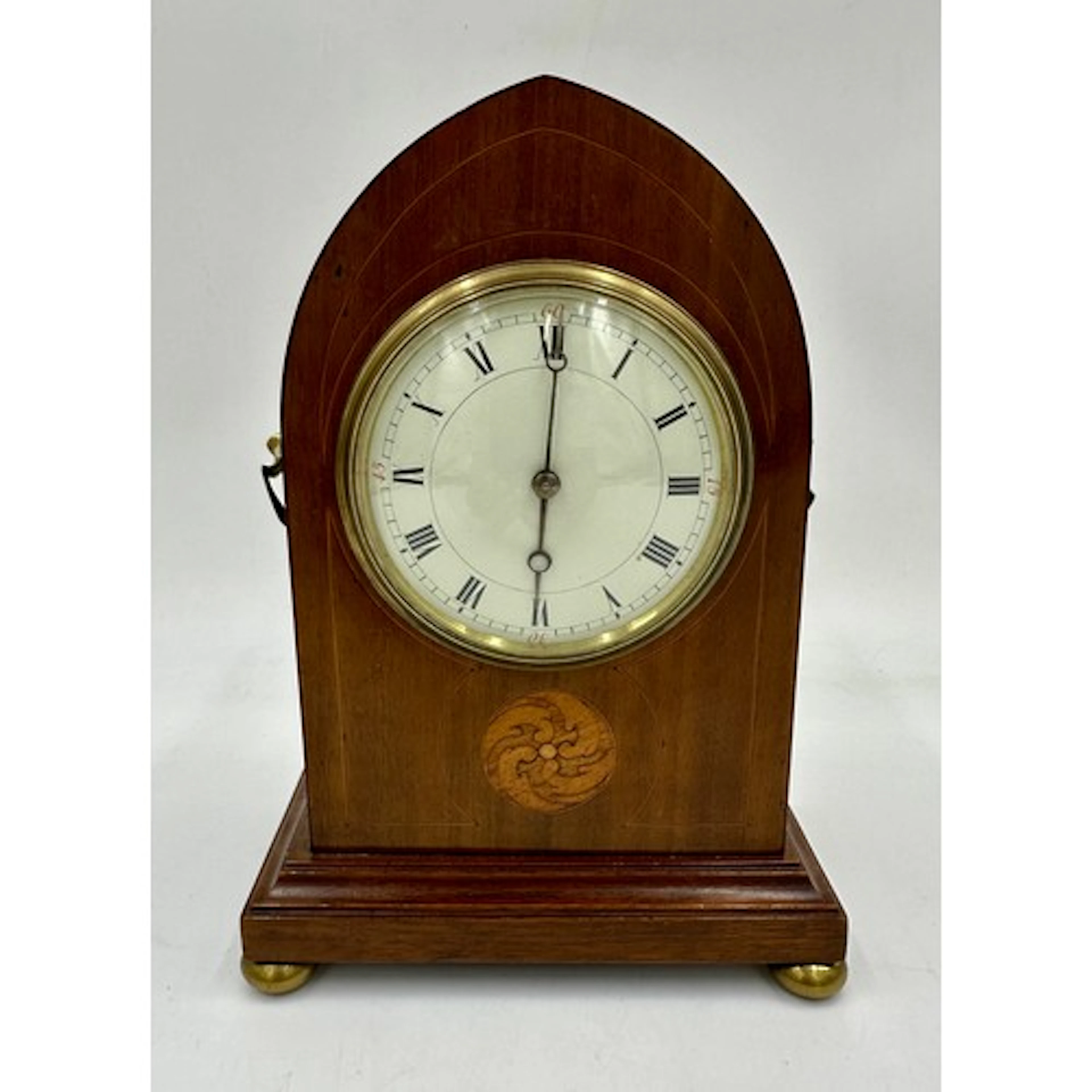 An Edwardian mahogany lancet top mantel clock with a French ...