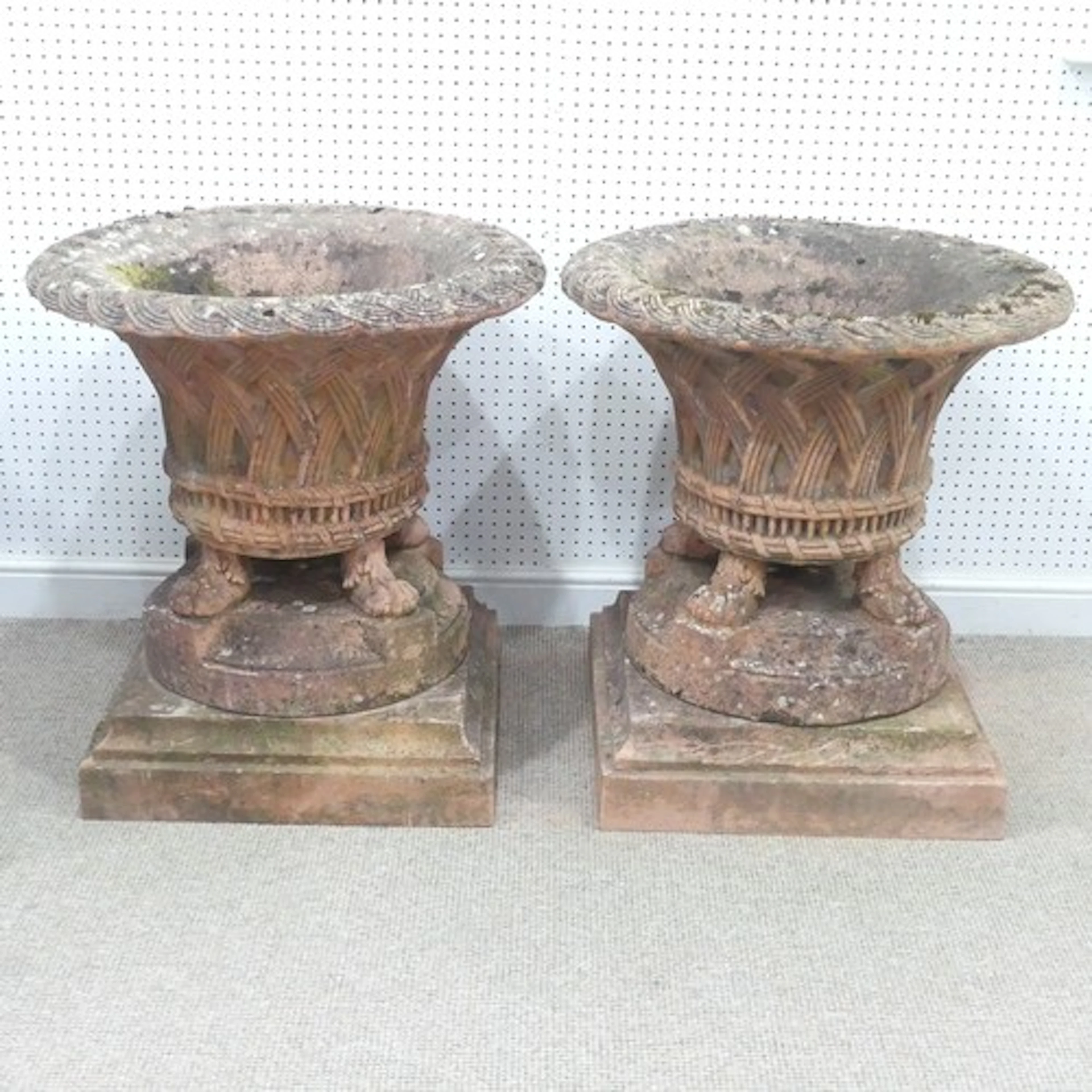 A pair of large and very substantial terracotta-coloured rec...