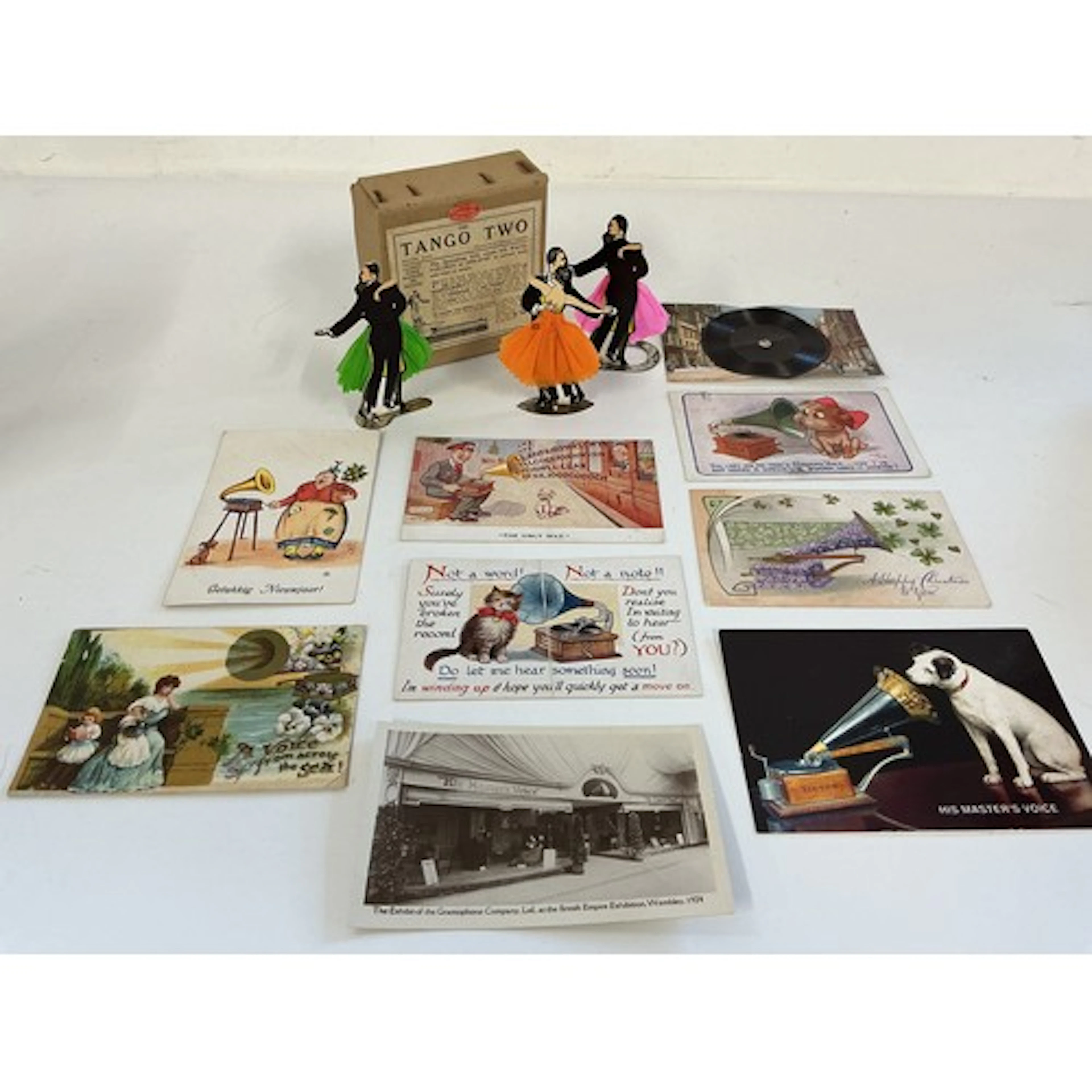 A collection of gramophone accessories including a boxed Tan...