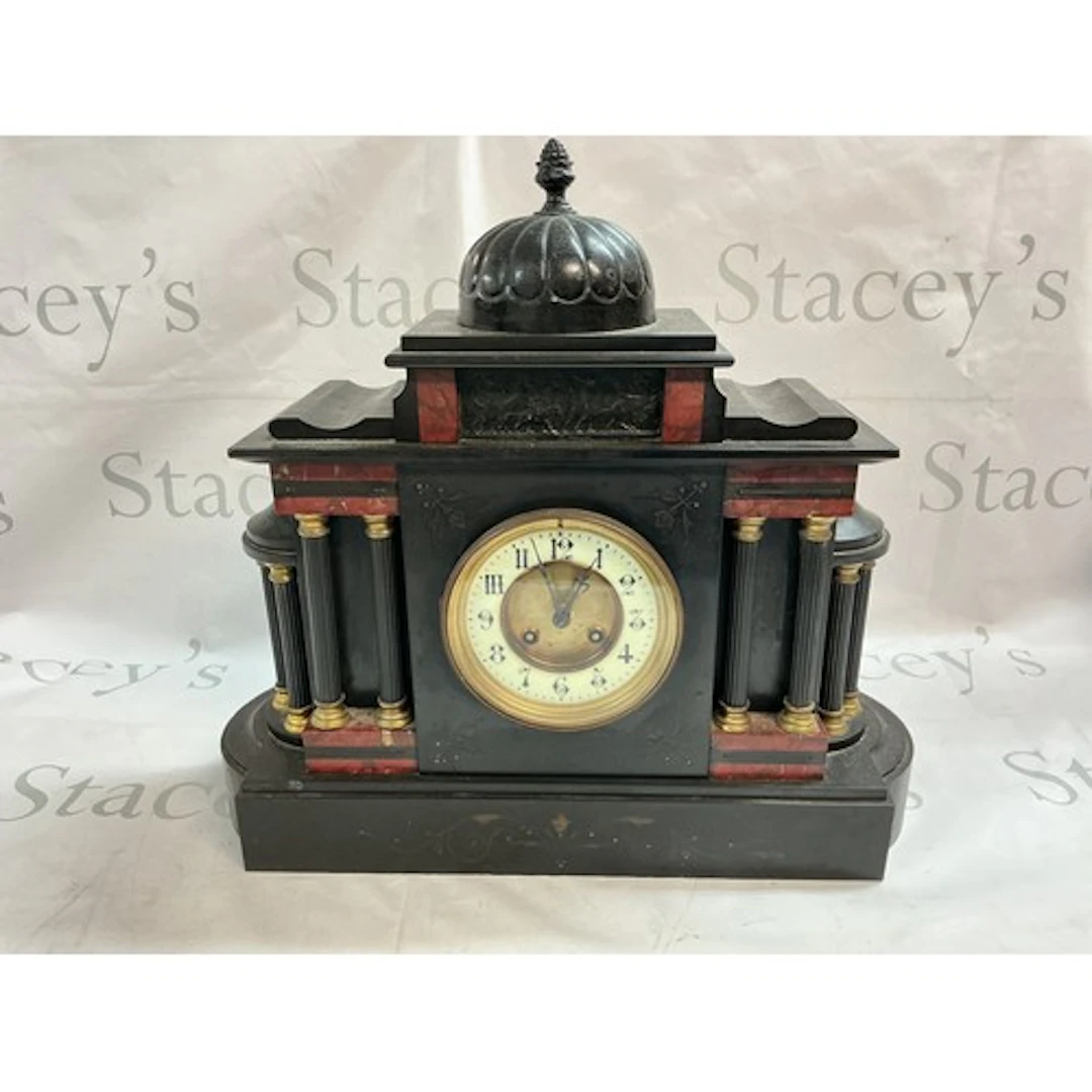 A Victorian black slate Mantel clock with a dome top