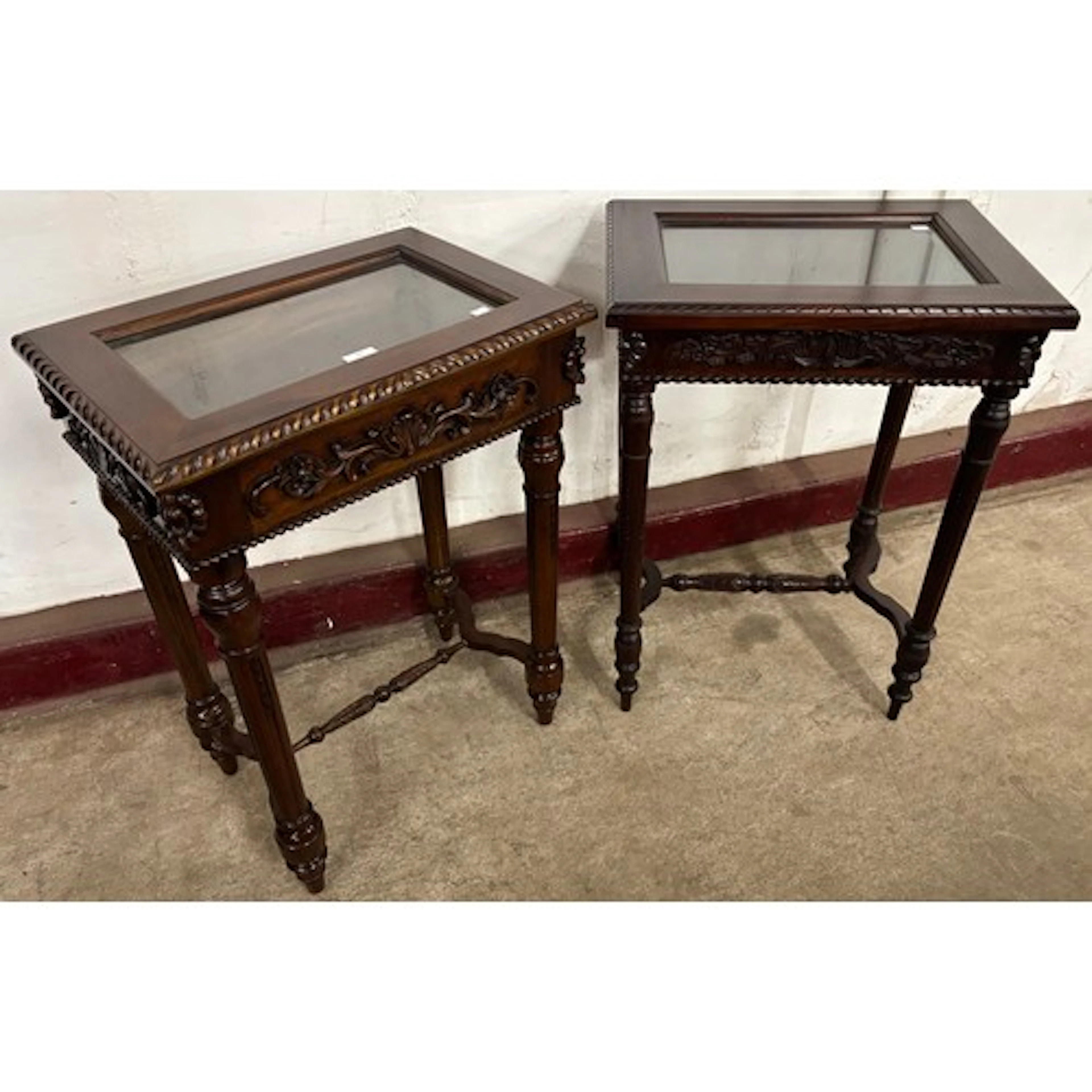 A pair of similar Chippendale style mahogany and glass toppe...