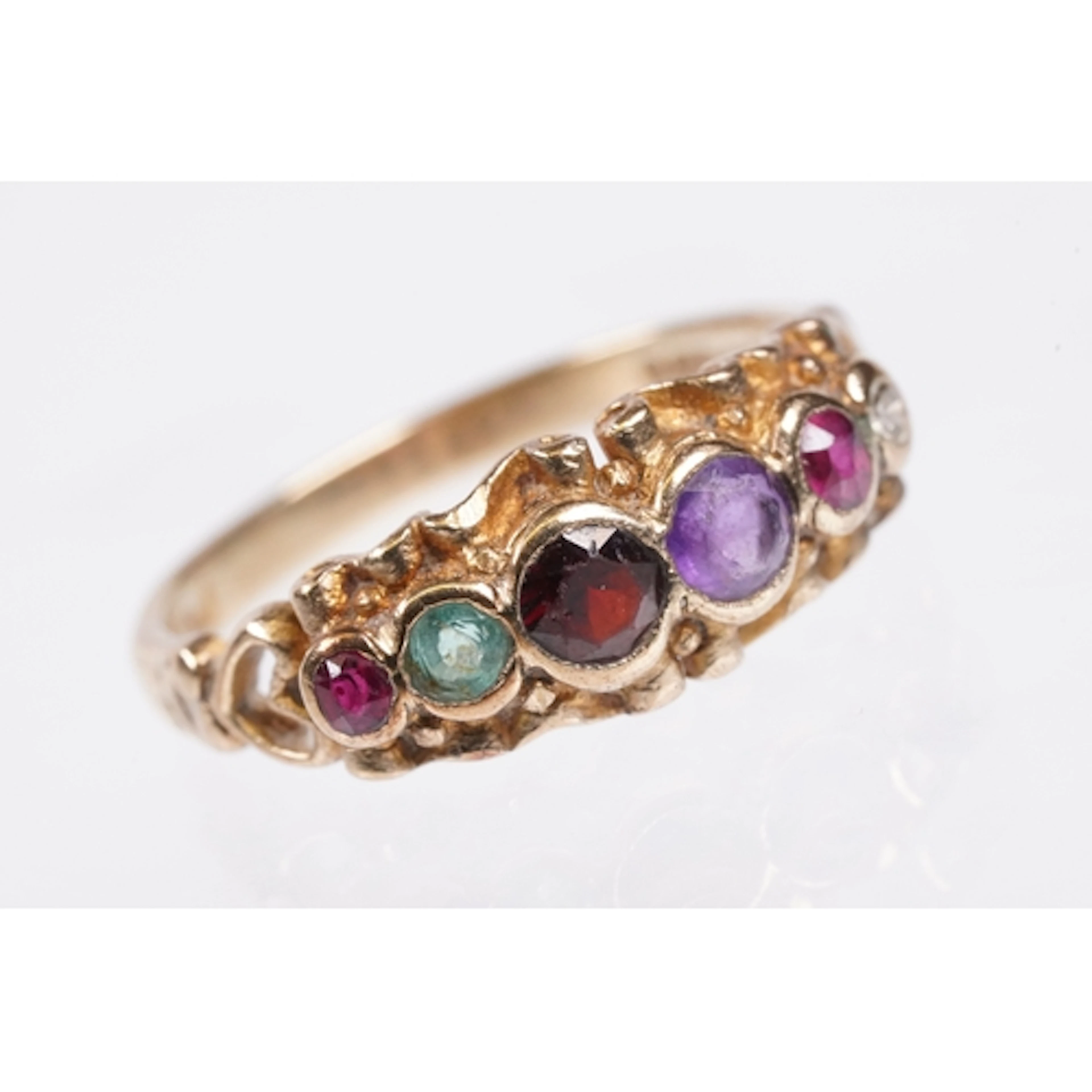 9ct gold 'regard' ring. The ring being set with round cut ru...