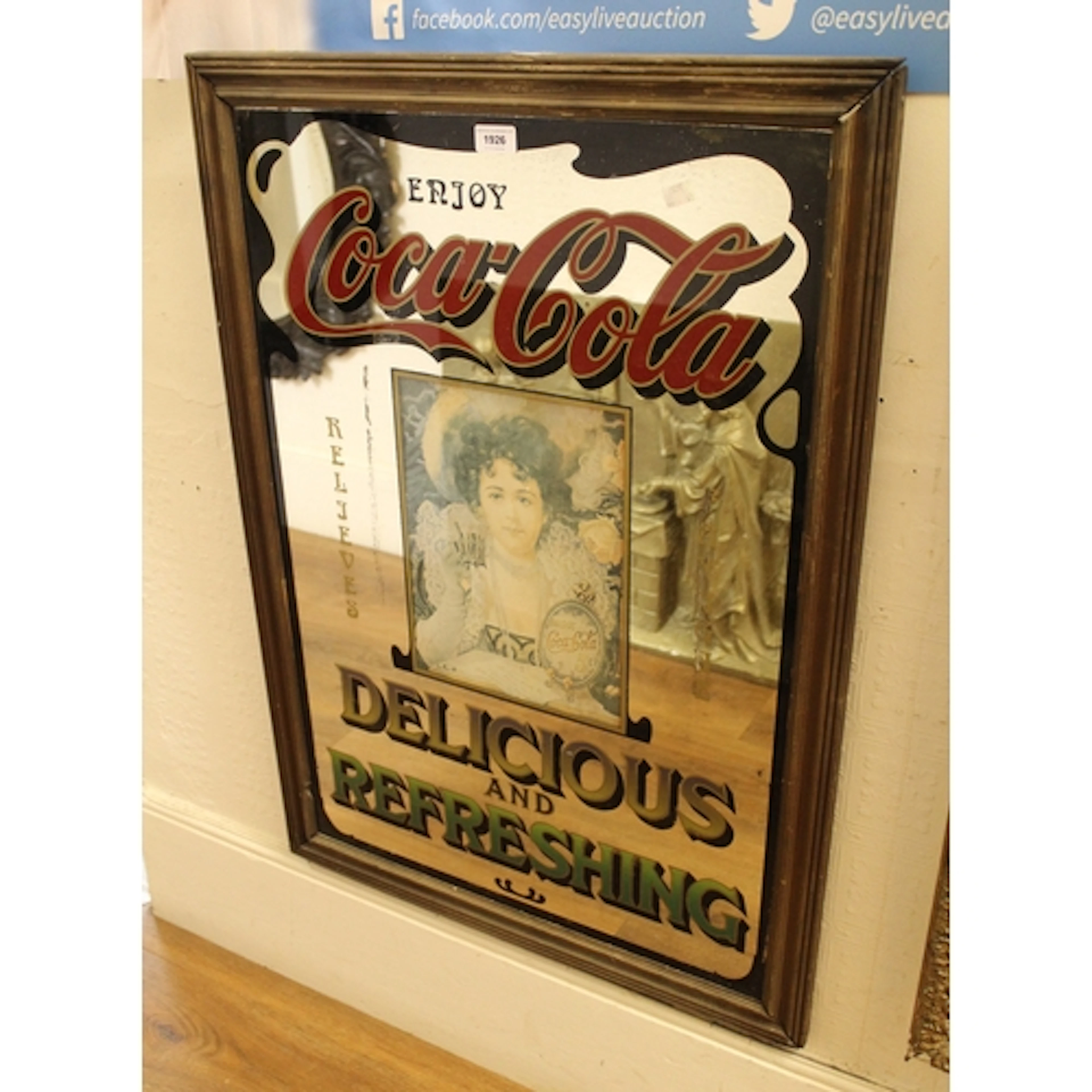 Coca Cola advertising mirror, inset with a print of a lady, ...