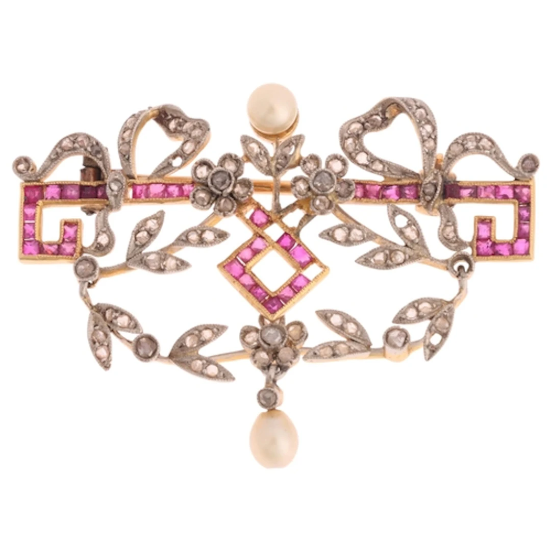 A Belle Epoque diamond ruby and pearl openwork garland brooc...