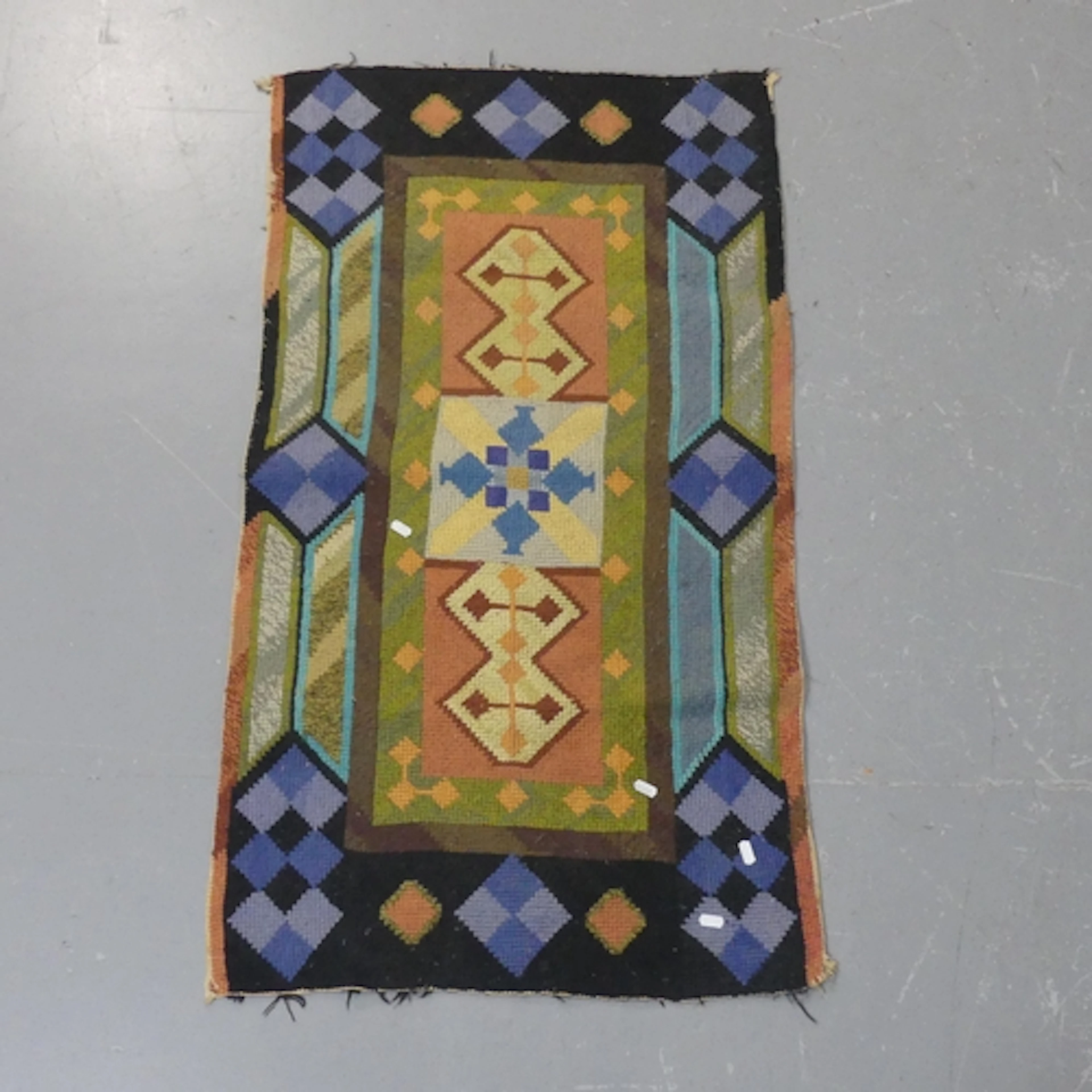A Scandinavian design tufted wool rug. Length 117cm, width 6...
