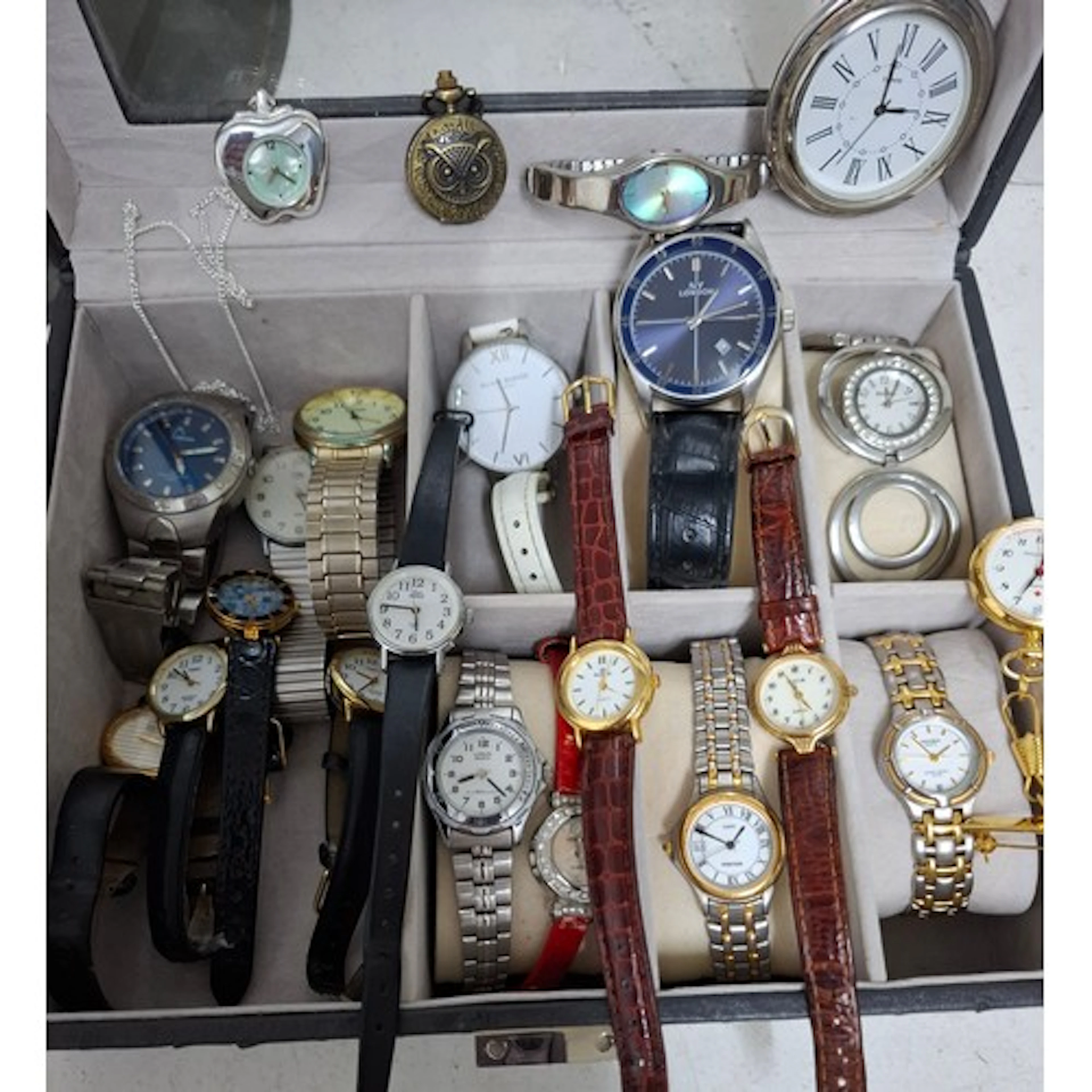 A quantity of modern fashion and sports watches all housed i...