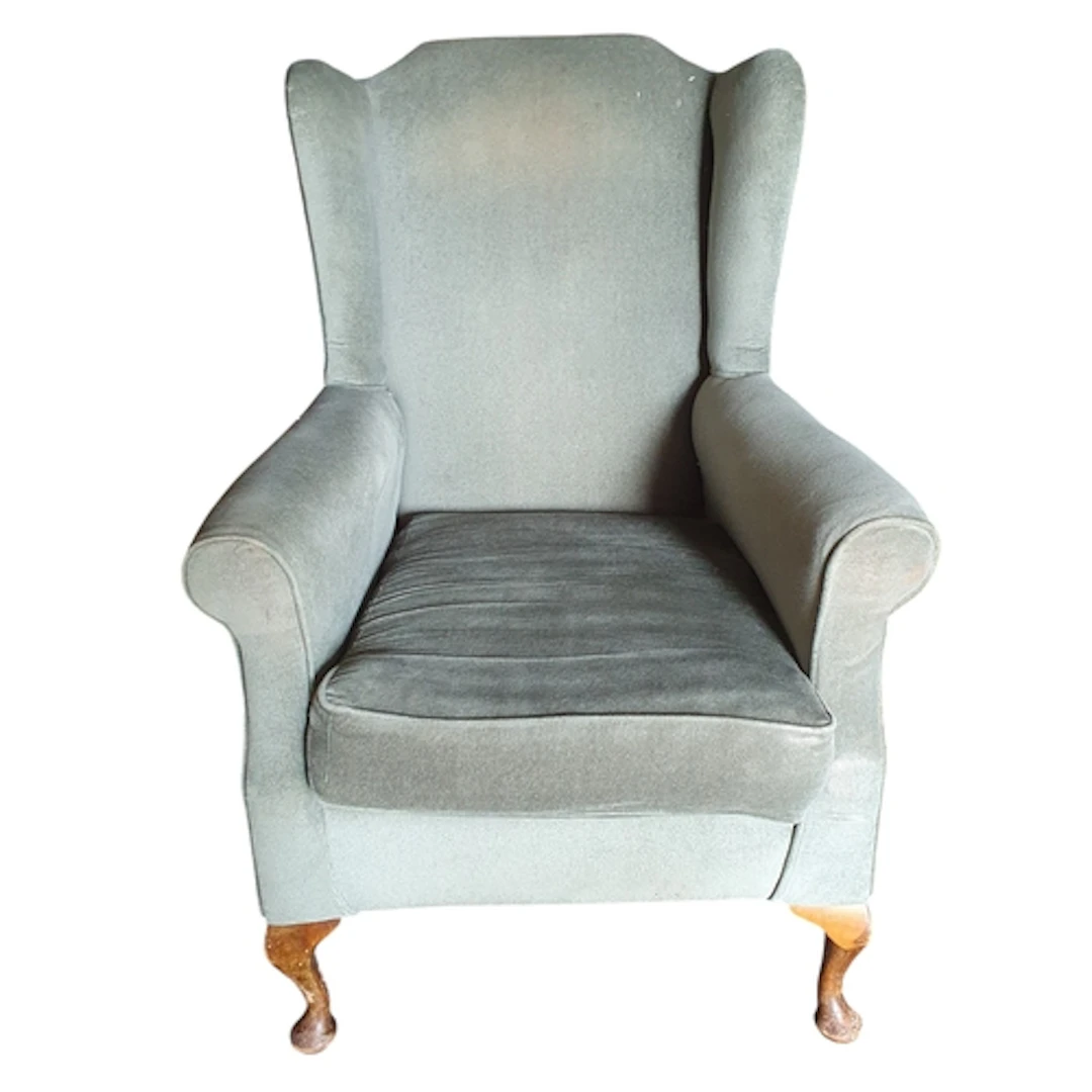 An early 20th Century Wingback Armchair with Green velvet up...