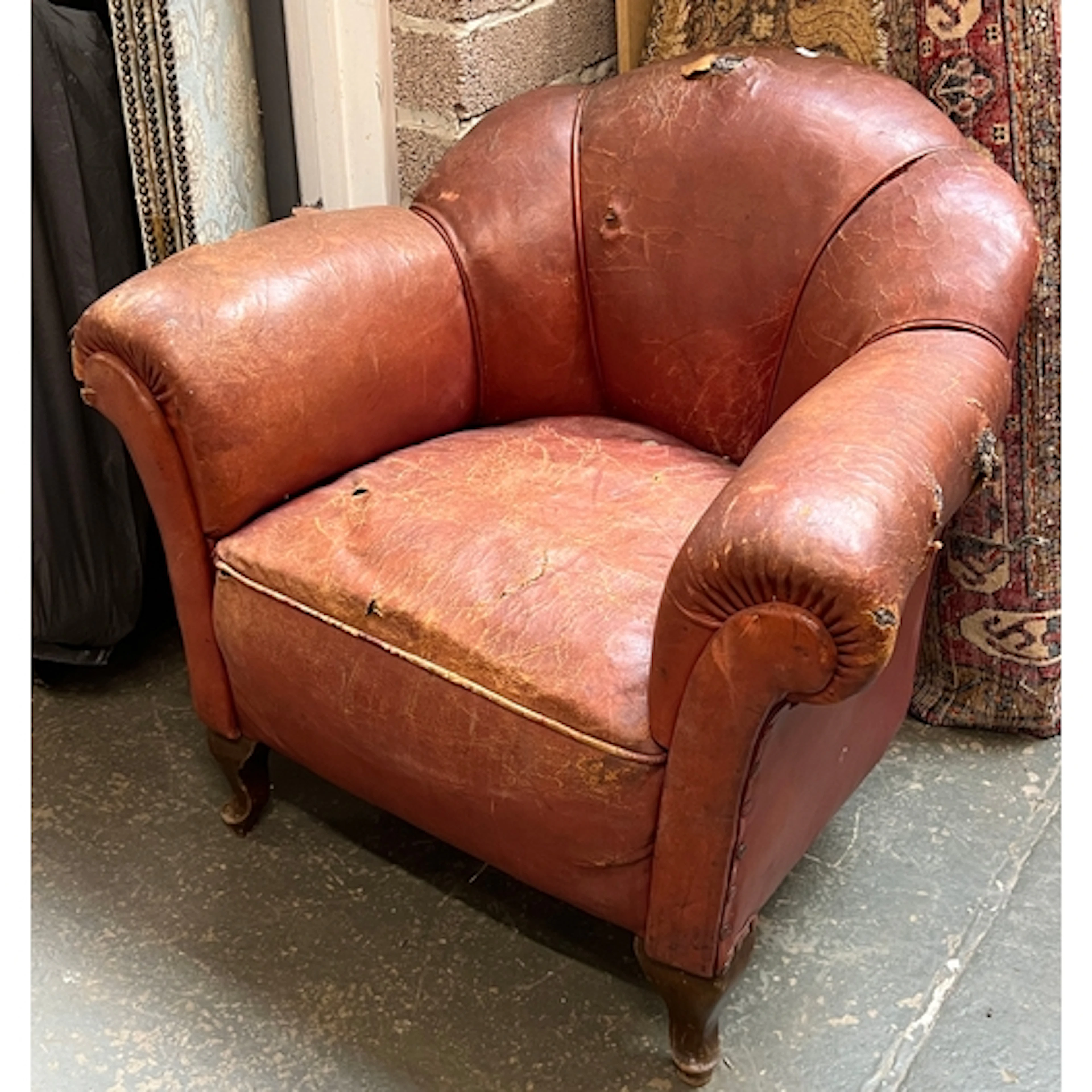 An Art Deco brown leather armchair, the covering AF, approx....