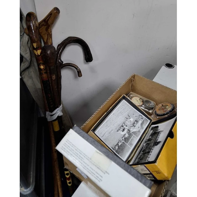 A BOX AND LOOSE WALKING STICKS, PHOTOGRAPHS AND SUNDRY ITEMS...