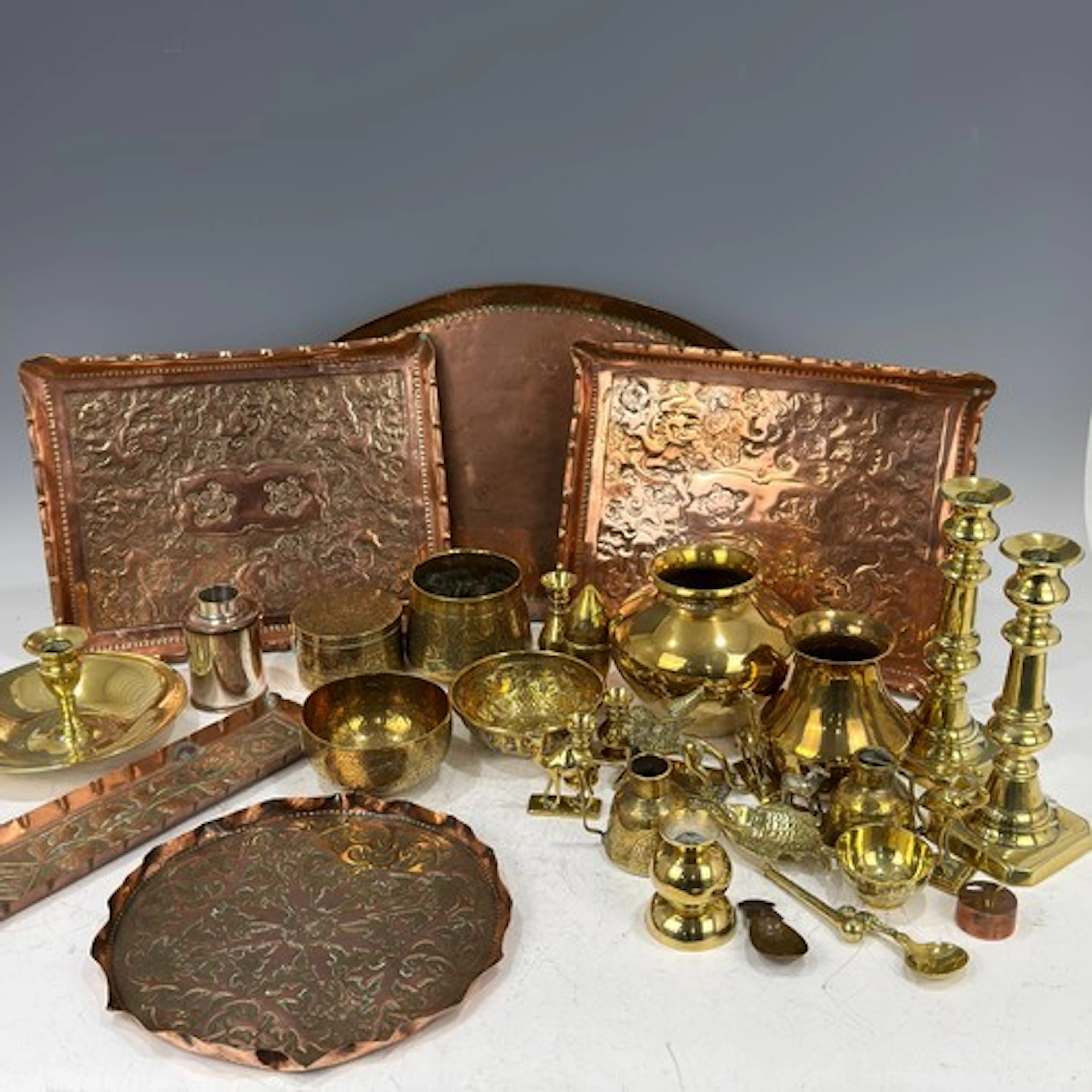 An Arts and Craft copper pen Tray, repousse decorated with s...