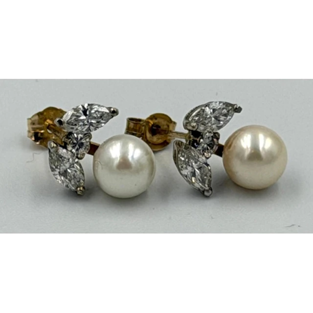 A pair of gold set pearl and diamond earrings