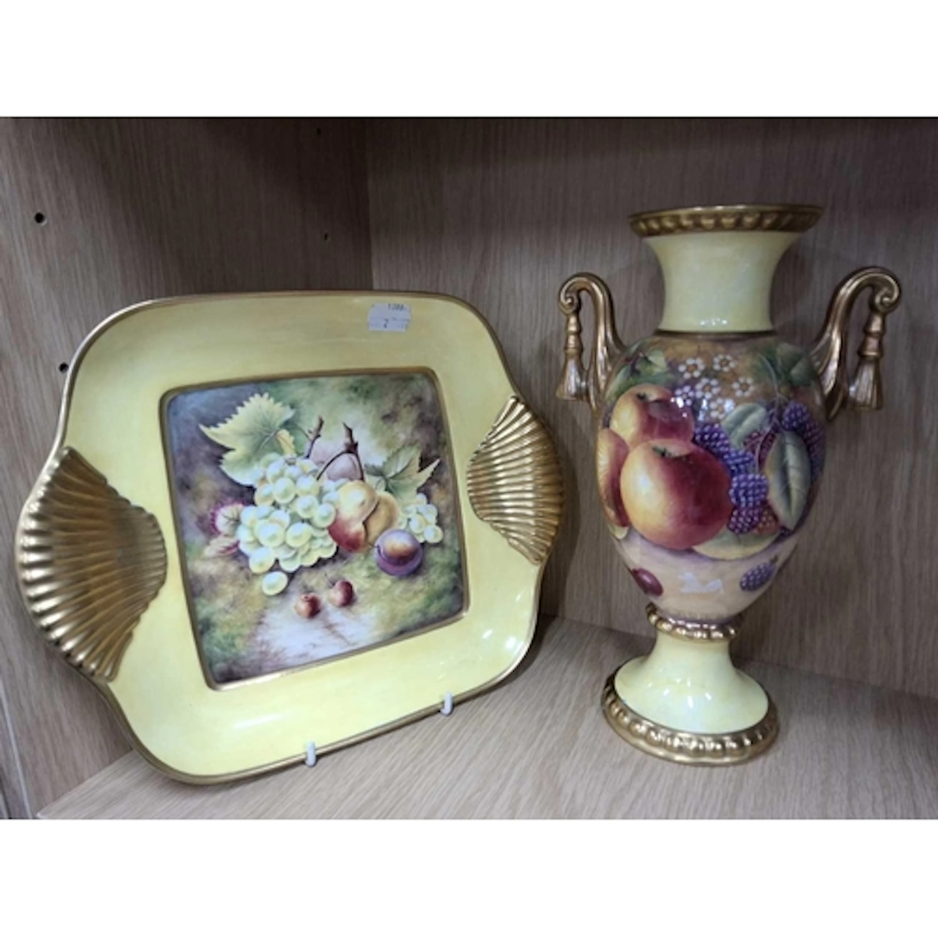 A PORCELAIN VASE AND PLATE HAND PAINTED BY BRYAN COX (FORMER...