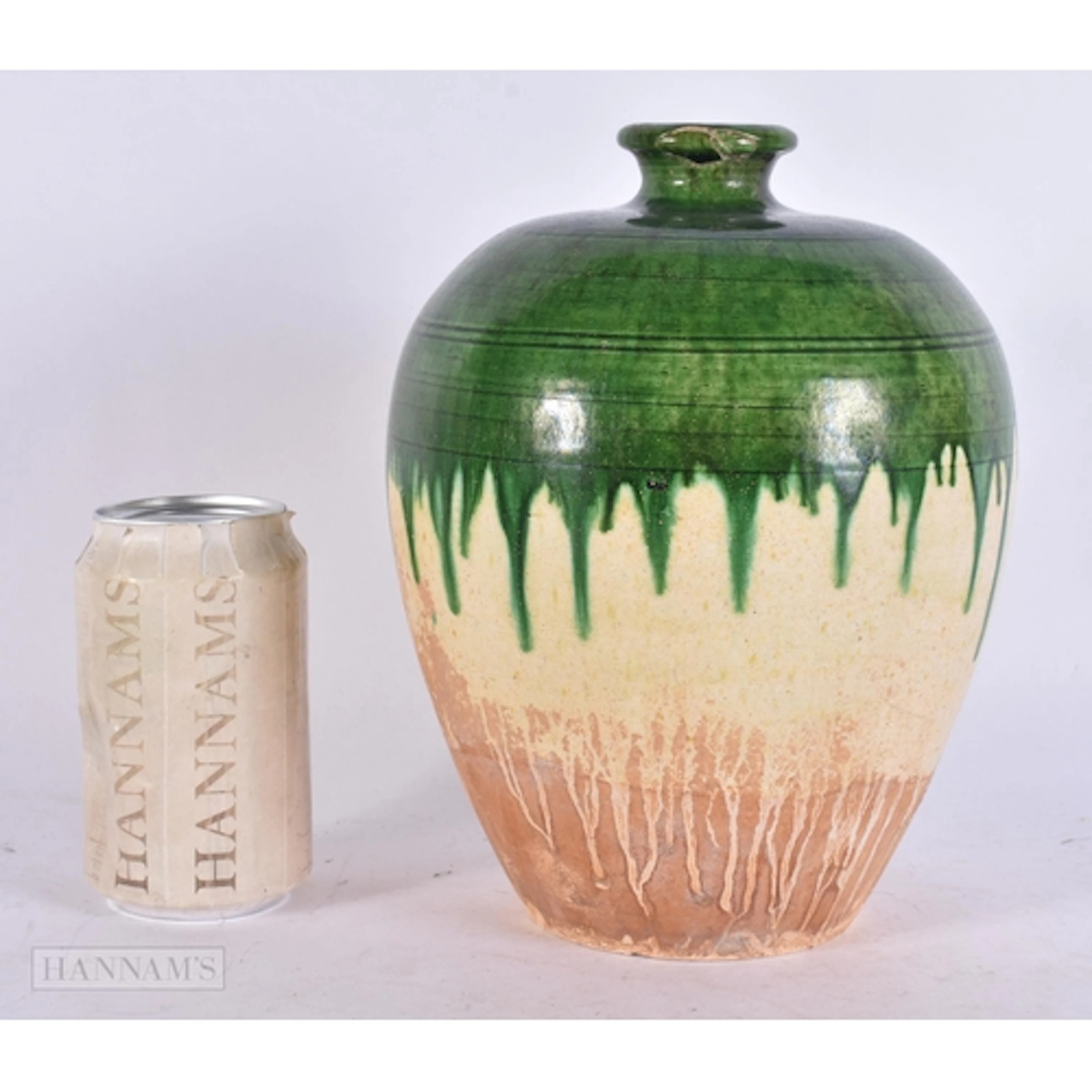 A FINE CHINESE TANG DYNASTY GREEN-GLAZED POTTERY JAR (AD 618...