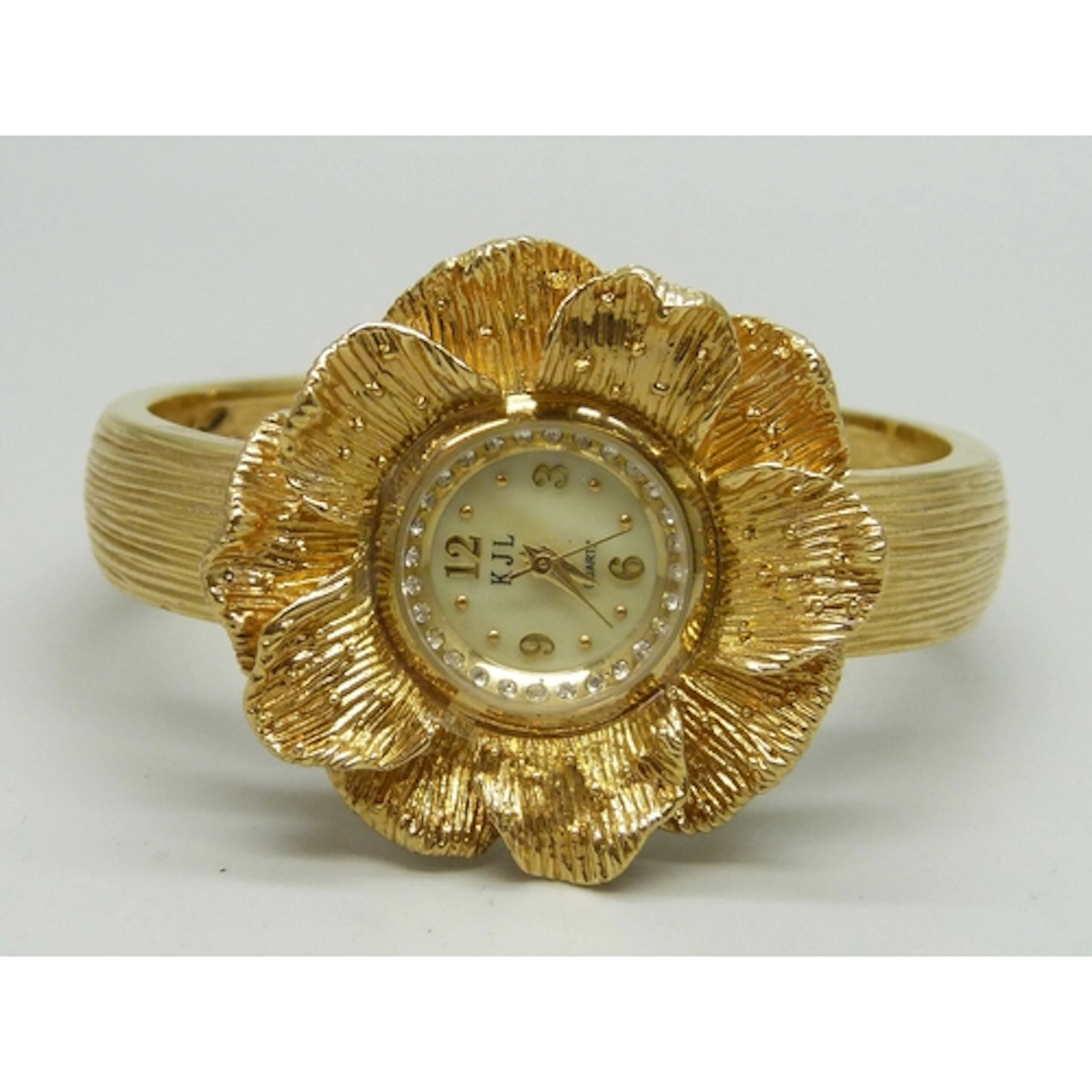 A Kenneth Jay Lane gold tone flower design bangle wristwatch...