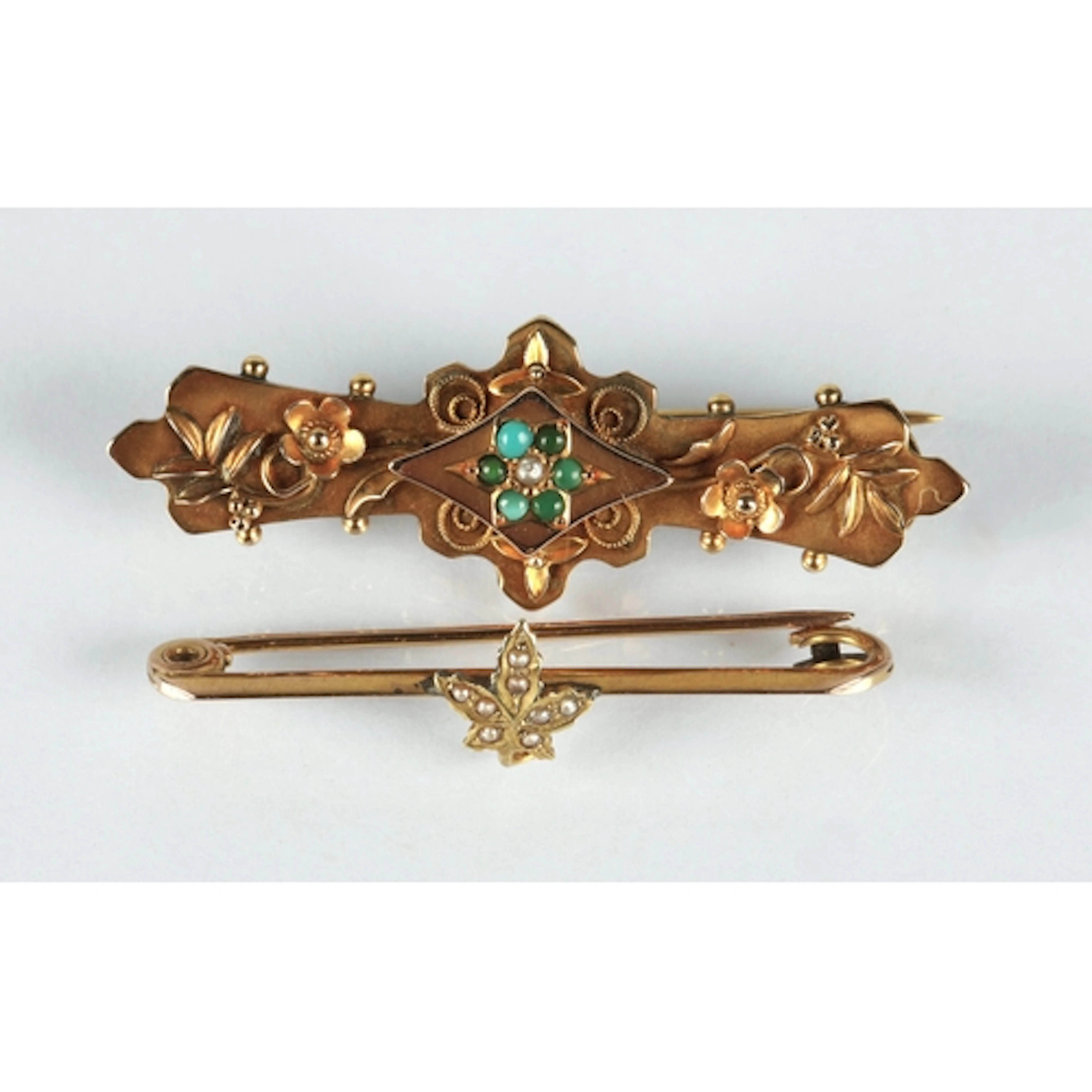 Two 9ct gold bar brooches, one with roses and turquoise ston...